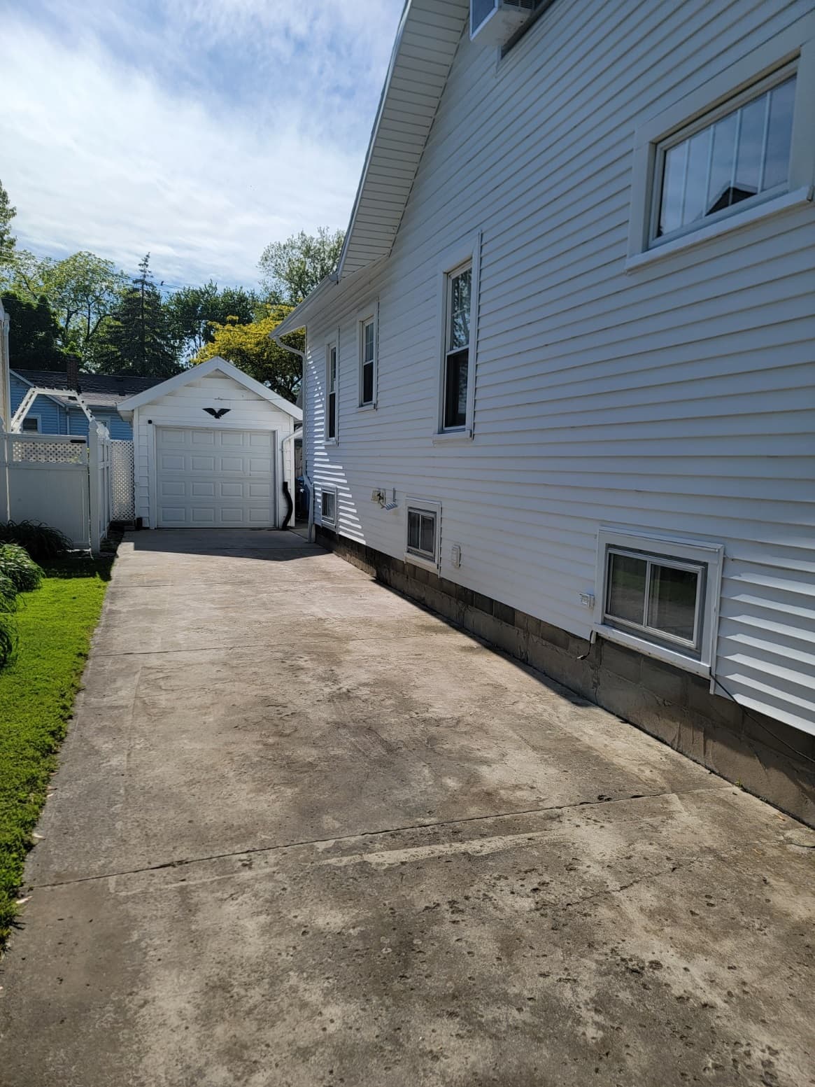 Long driveway leading to back patio area