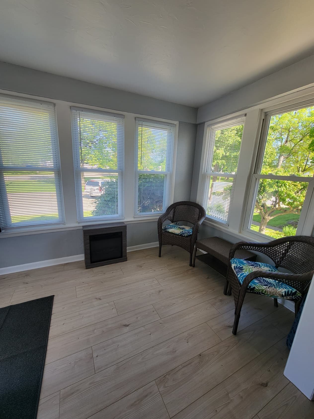 Front Sunroom seating with lake and park views