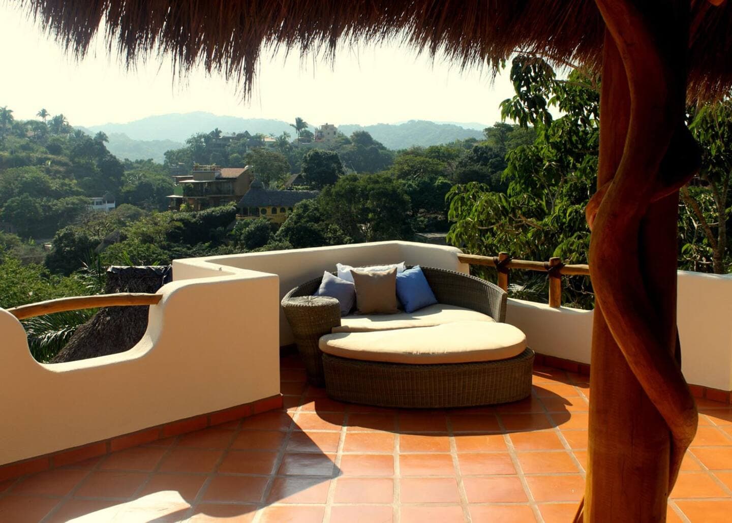 Rooftop terrace featuring comfortable seating and 360 views of town and ocean.