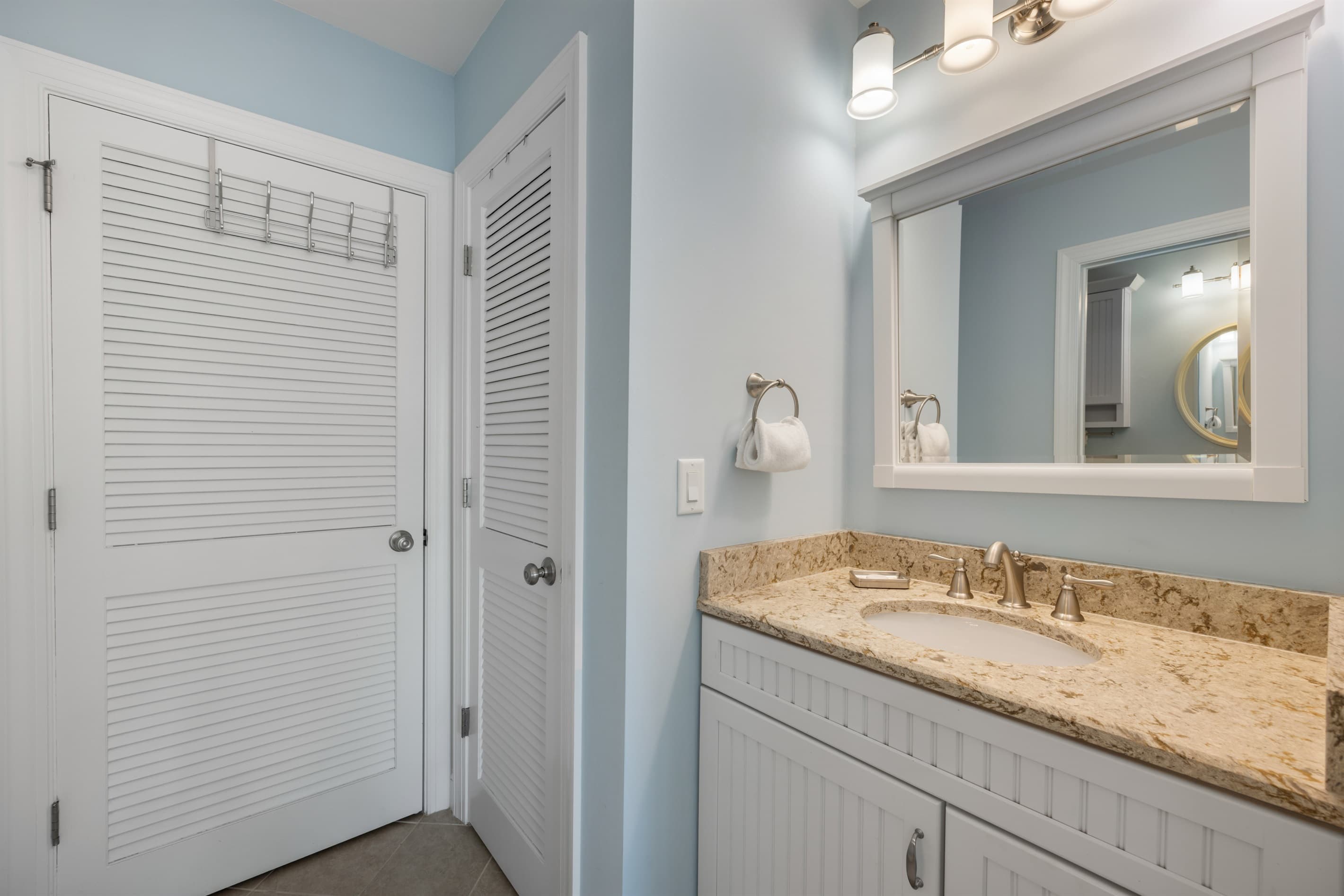 Crisp powder room vanity w/ simple, modern touches.
