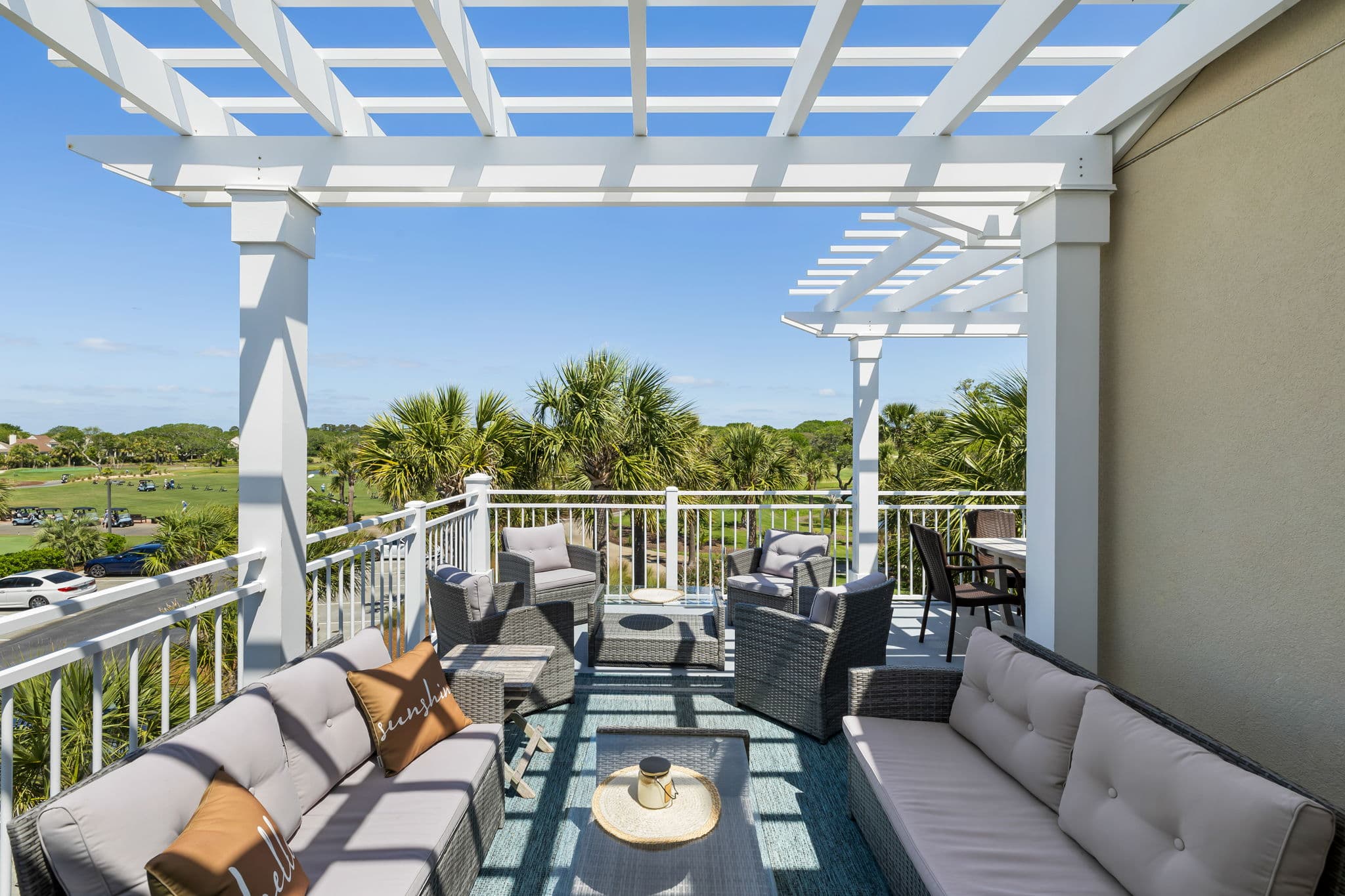 Poolside pergola perfect for sunny sips & chats.