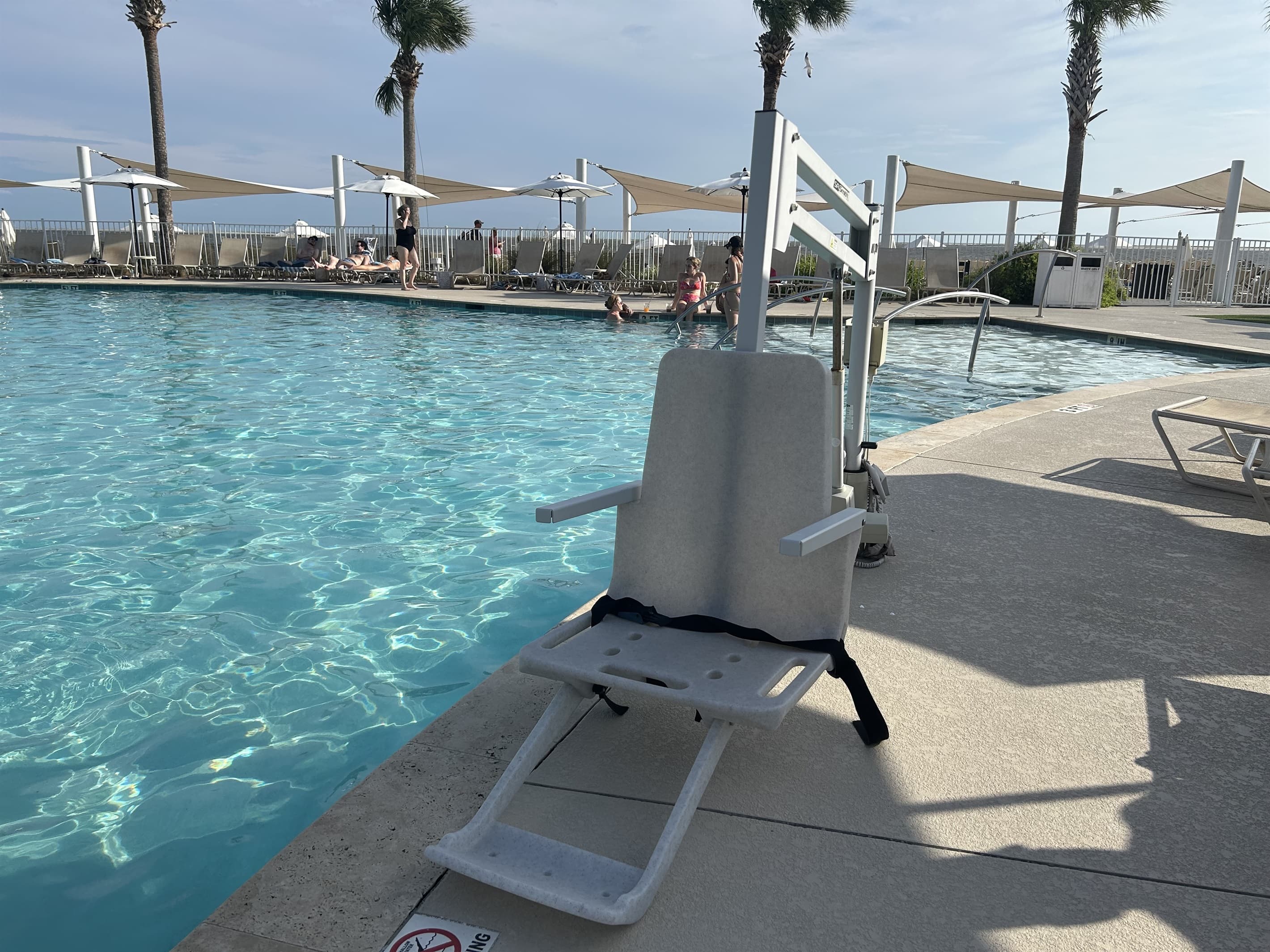 Poolside seating w/ wide water views to unwind.
