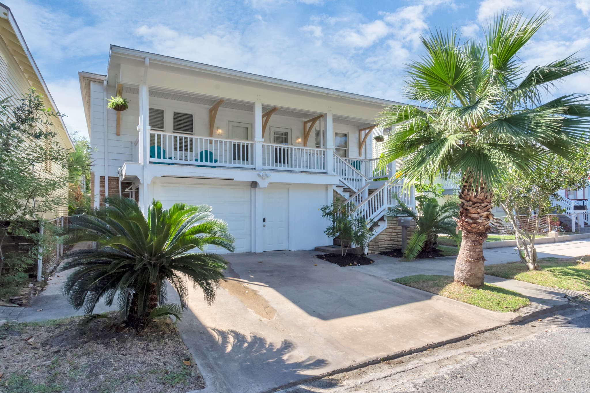 Classic Galveston curb appeal — the Historic Anchor at M is a beautifully maintained piece of island history surrounded by swaying palms.