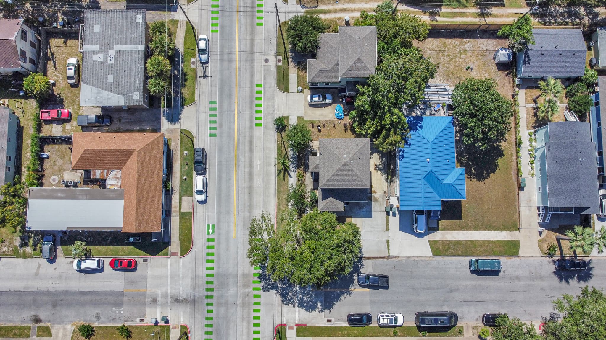 Summer Bliss from above — corner lot, private yard, and two-car driveway all visible at a glance. Plenty of room outside to match the space inside.