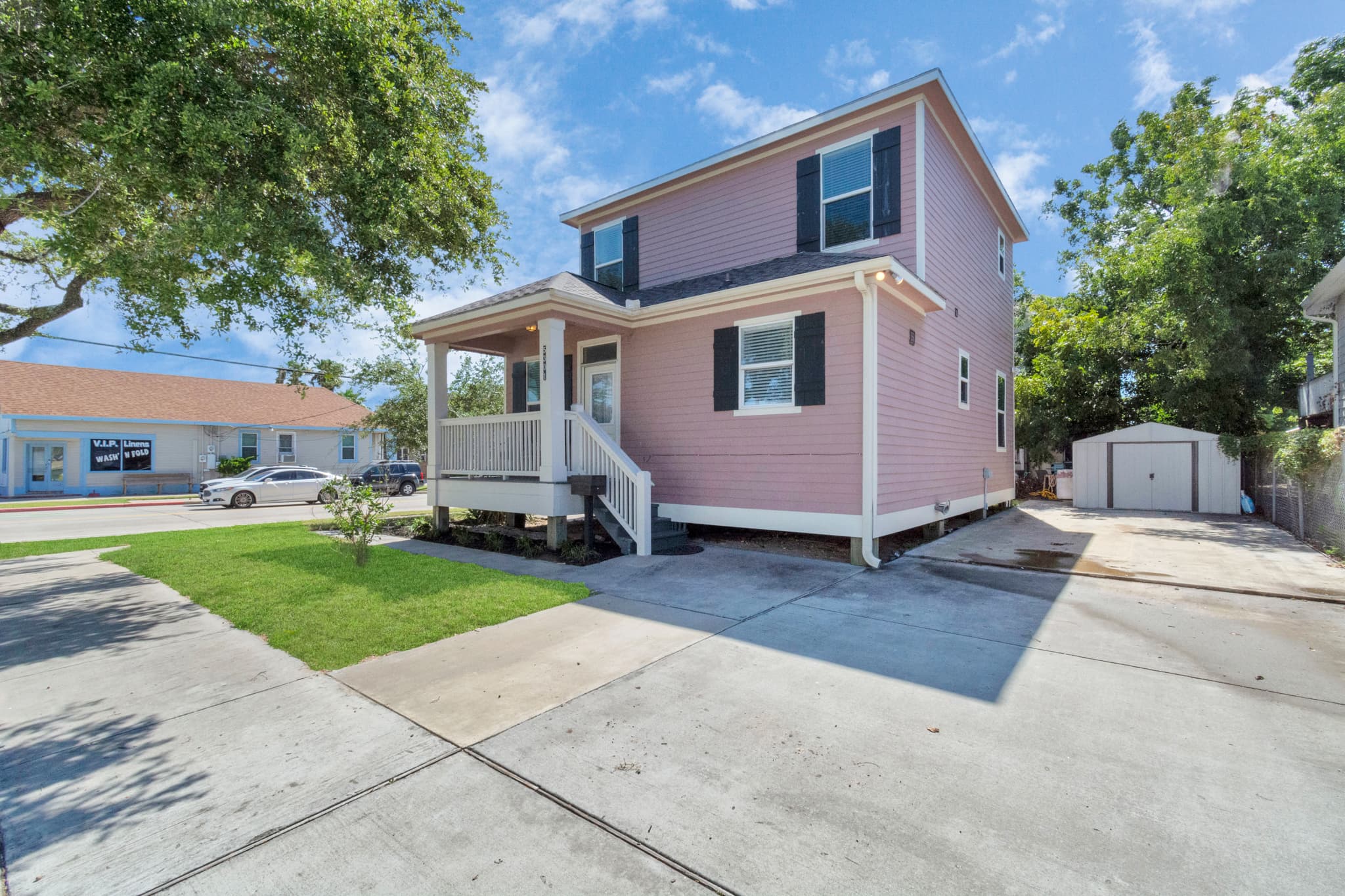 The large driveway at Summer Bliss — room for 2 vehicles, easy corner access, and a generous front yard for group arrivals with all the gear.