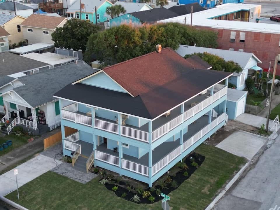 The Lookout at R½ at 3127 Avenue R½, Galveston — a top-floor retreat steps from the Seawall with a private hot tub, sauna, and wraparound deck.