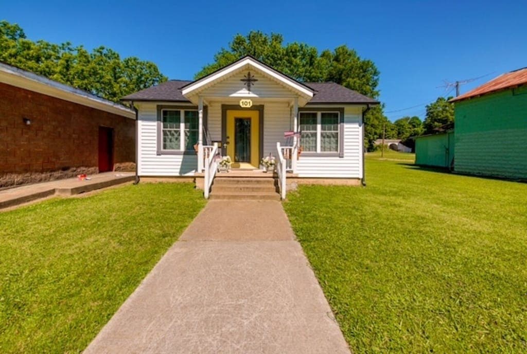 A long walkway leads from the street right up to the front door of Brighton Bungalow.