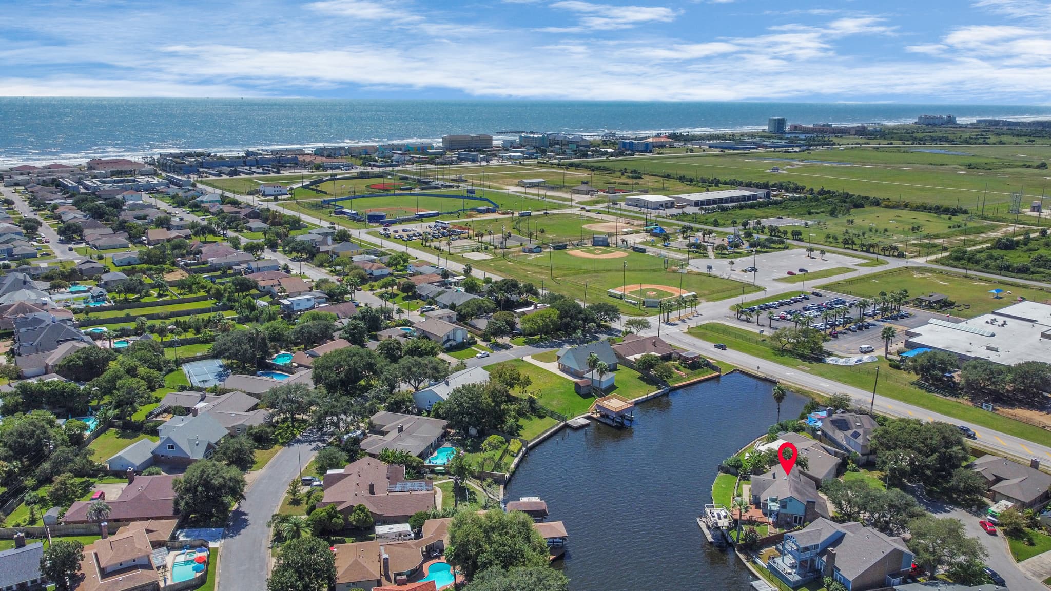 Aerial view of the Galveston waterway near Lakeview Landing — Moody Gardens and Schlitterbahn are a short walk from the front door.
