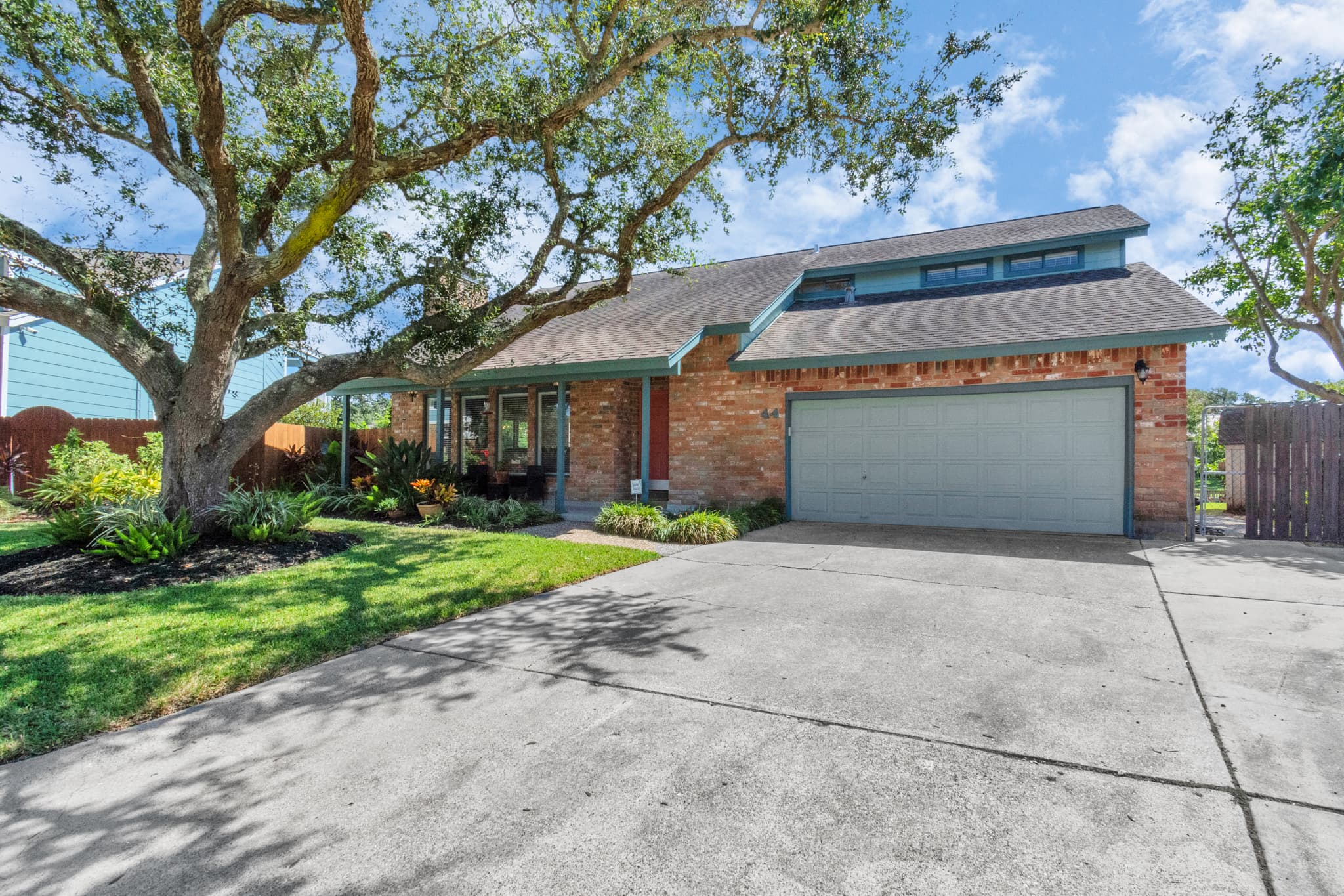 Lakeview Landing — a beautifully maintained waterfront home at 44 Lakeview Drive, Galveston TX, with timeless curb appeal.