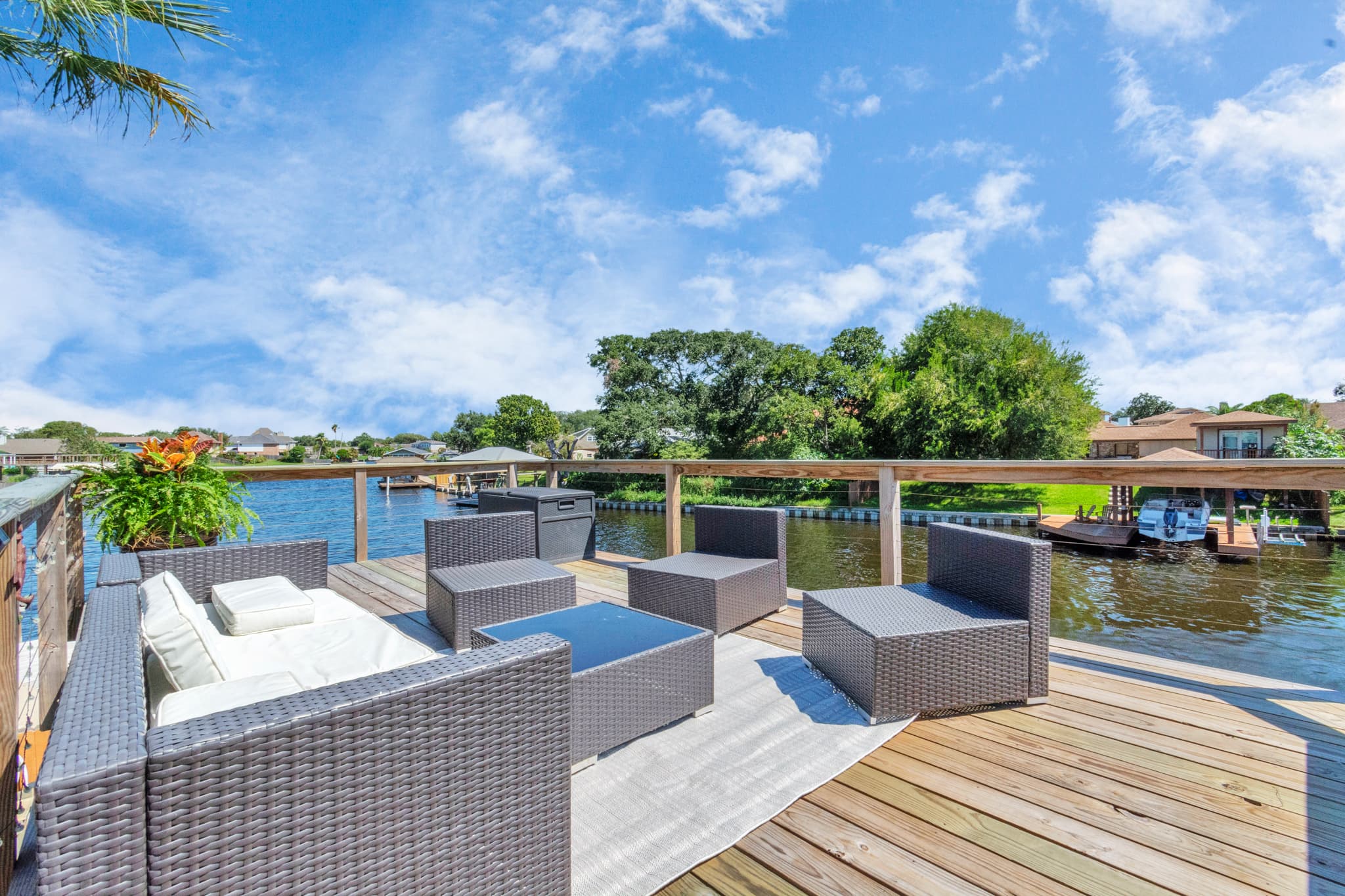 Dock-side seating at Lakeview Landing — watch the boats pass on Madeline Lake from your private outdoor waterfront retreat.