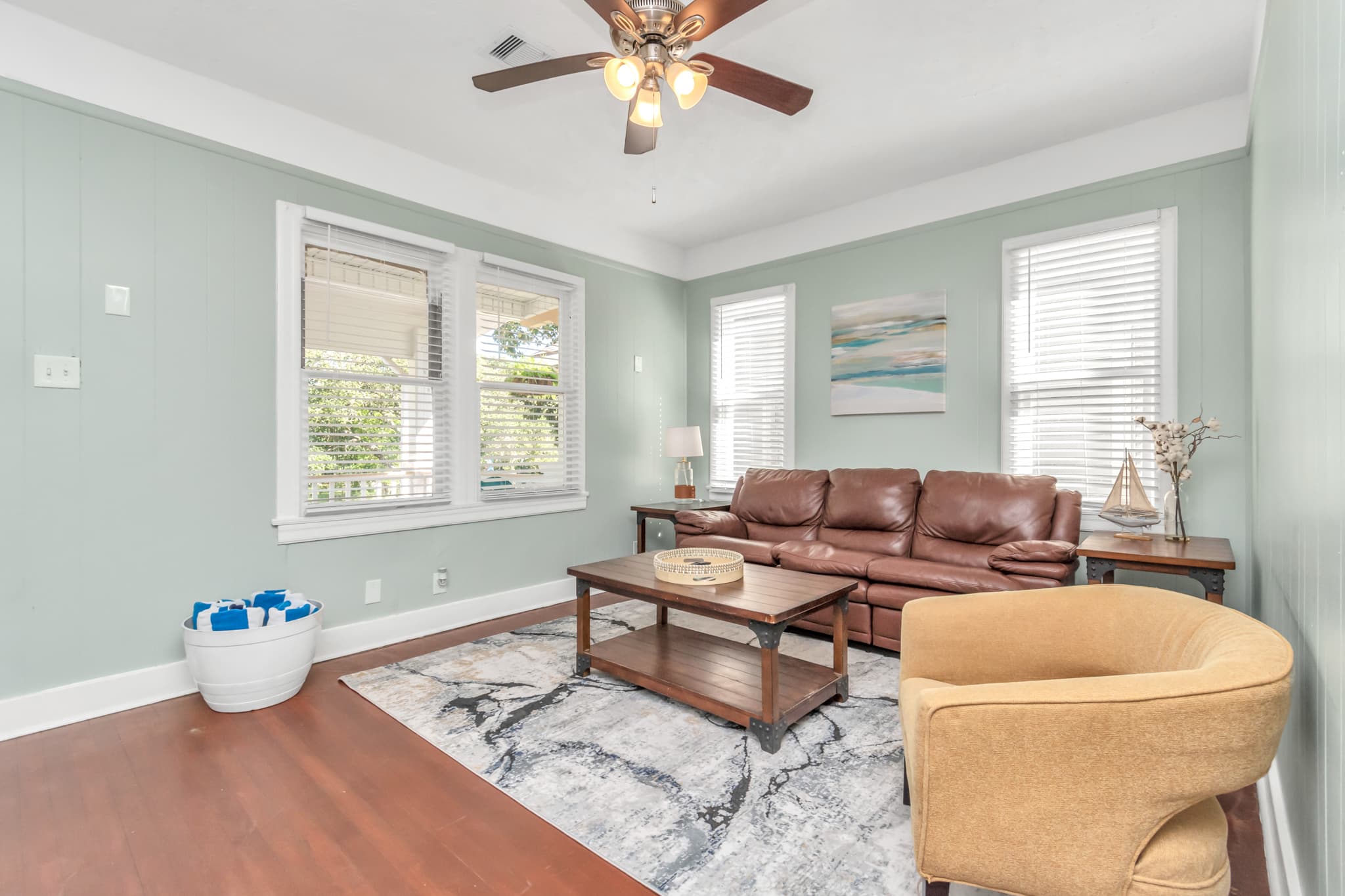 Light and airy living room area off the front door allows for good access to the outside as well as the kitchen and dining area!