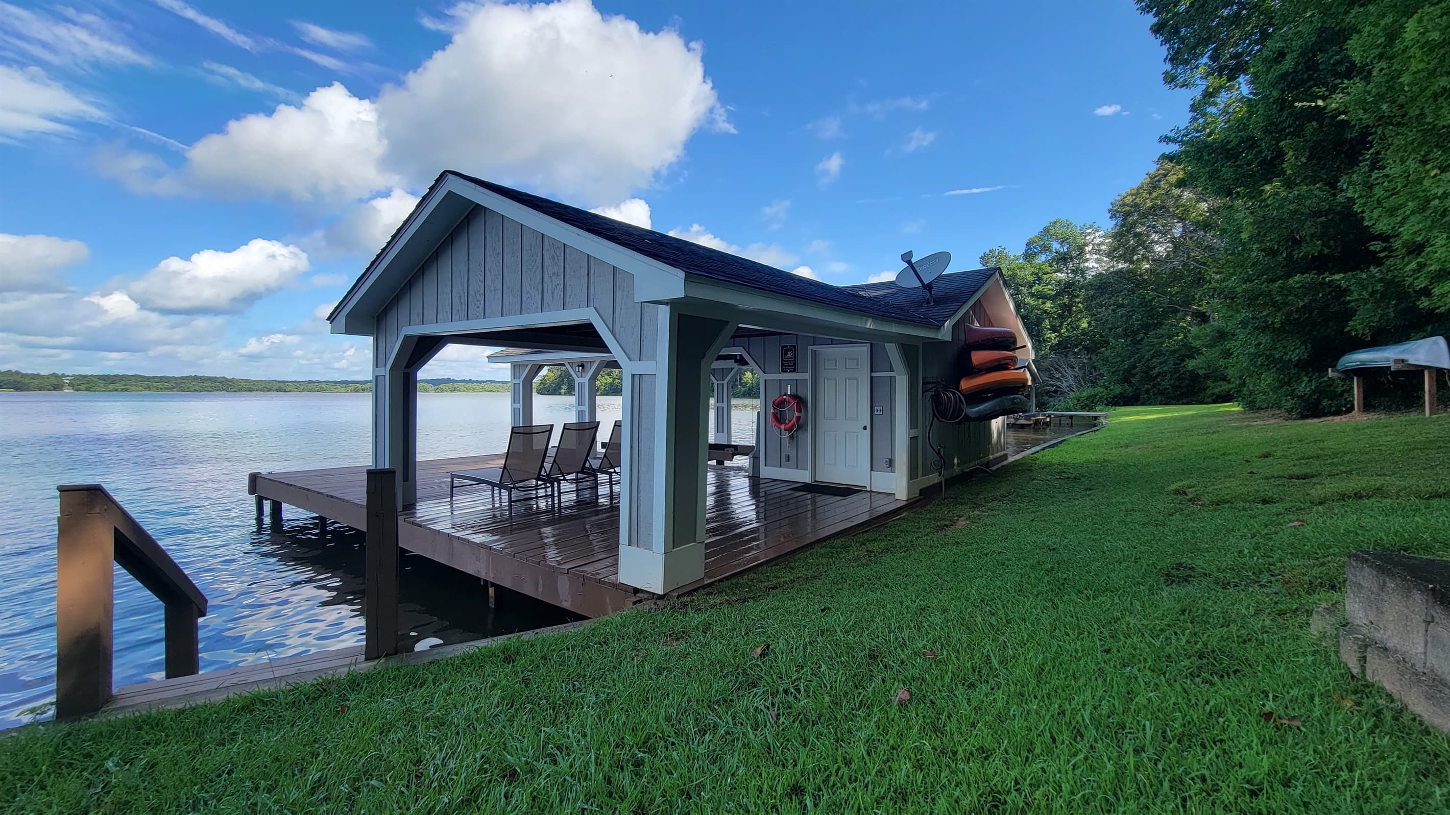 Private dock with 4 kayaks, 2 SUPs, and 1 Canoe