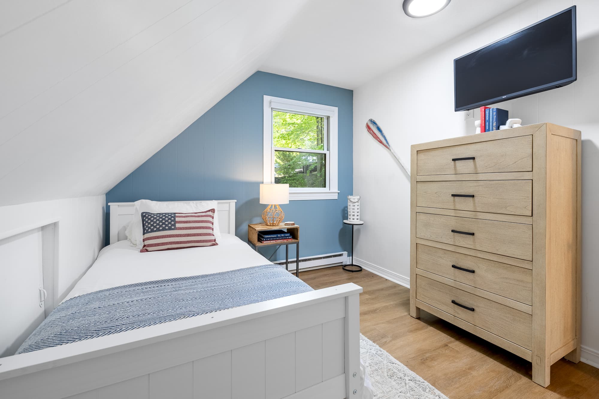 Comfy twin room filled w/ soft natural light