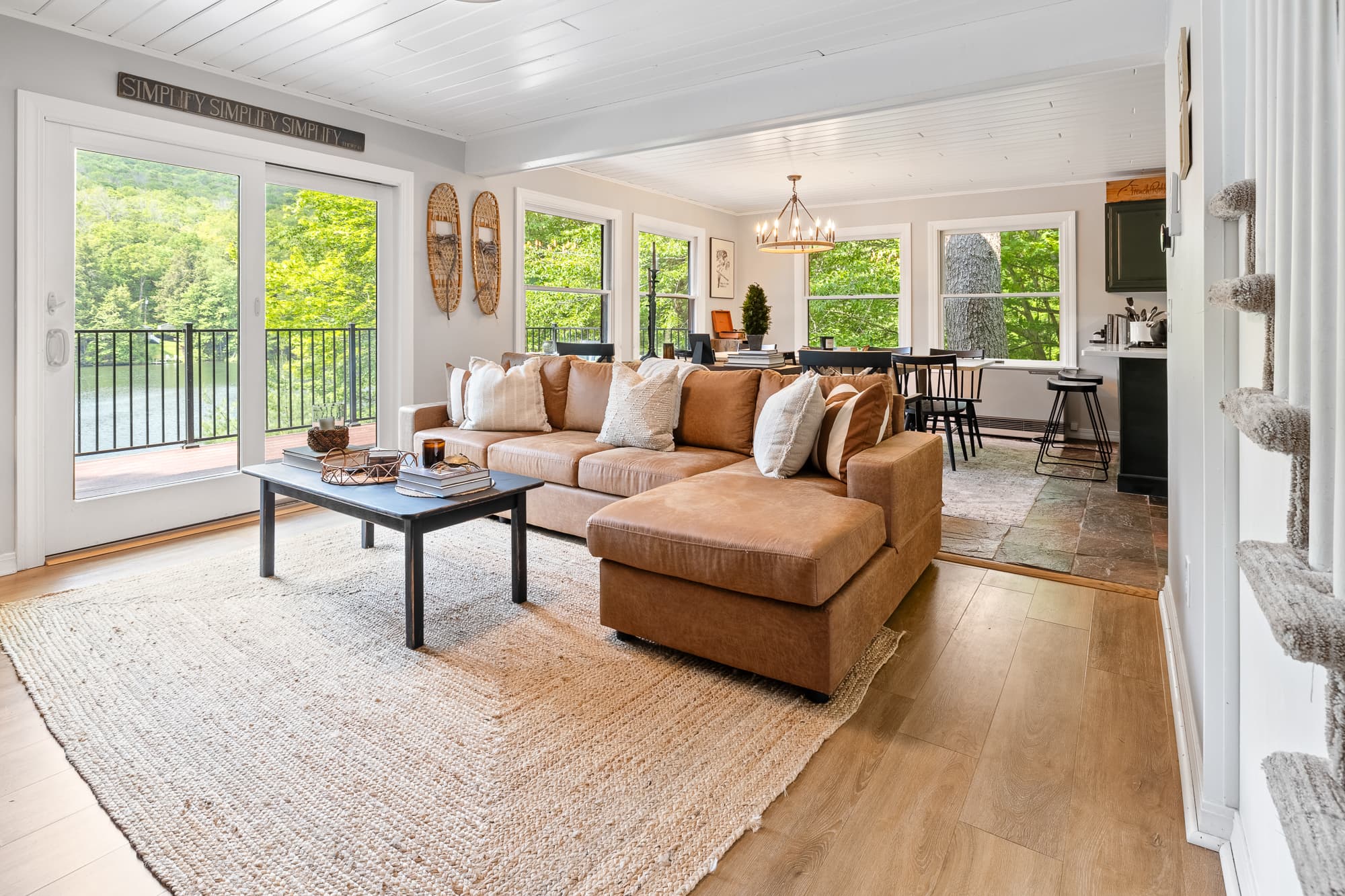 Warm living area w/ leather seating & forest views