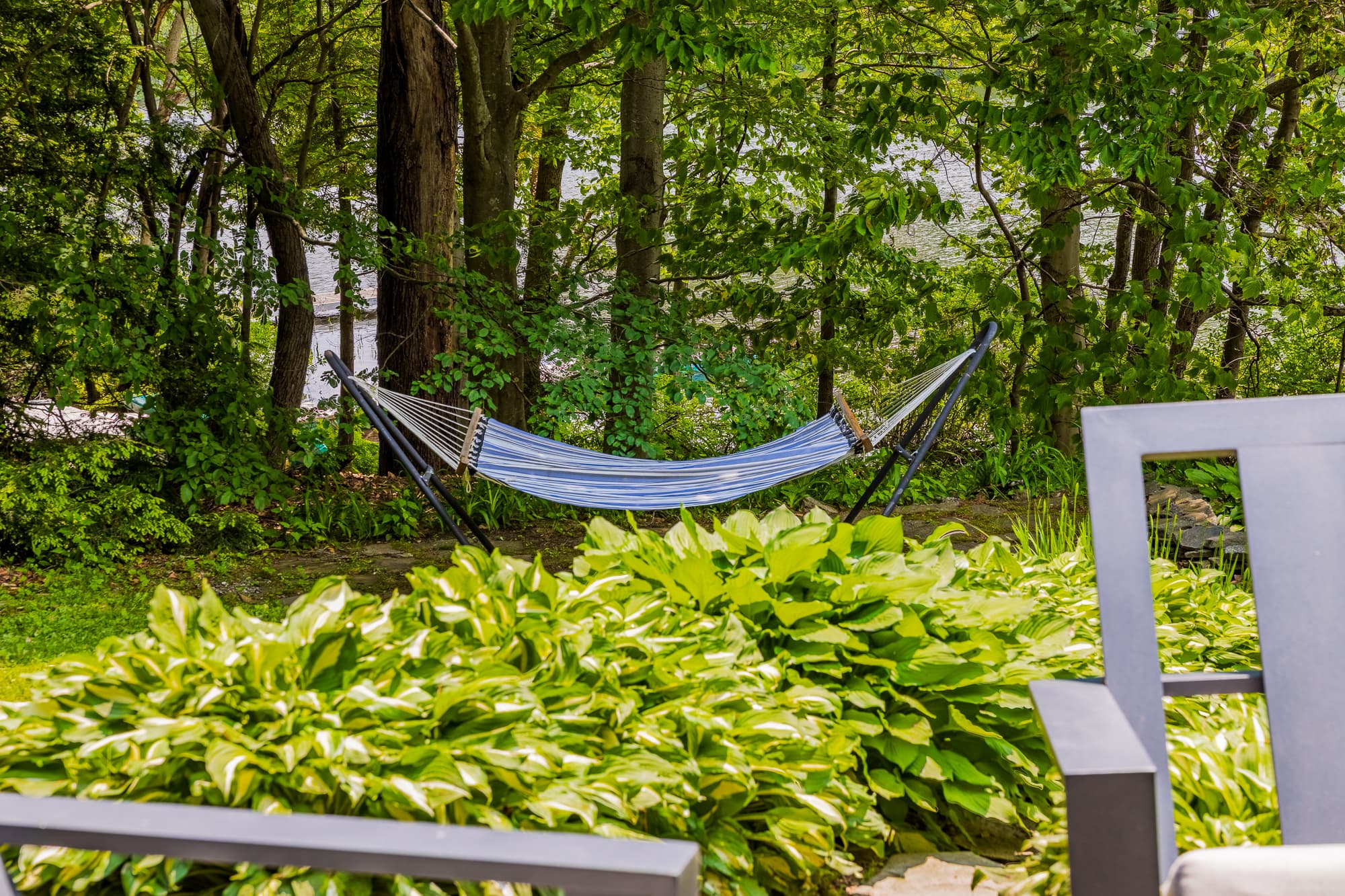 Shaded hammock tucked in the trees for lazy naps