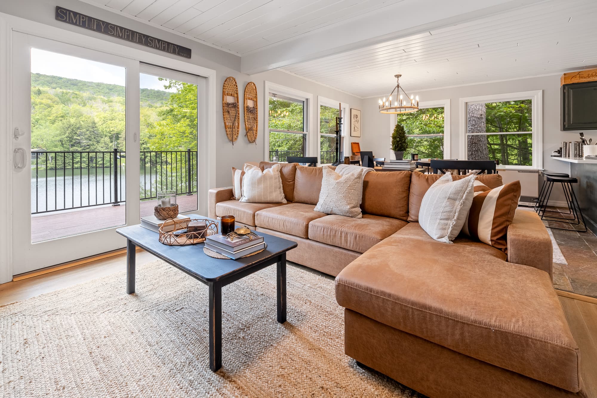 Sunlit living room overlooking the trees