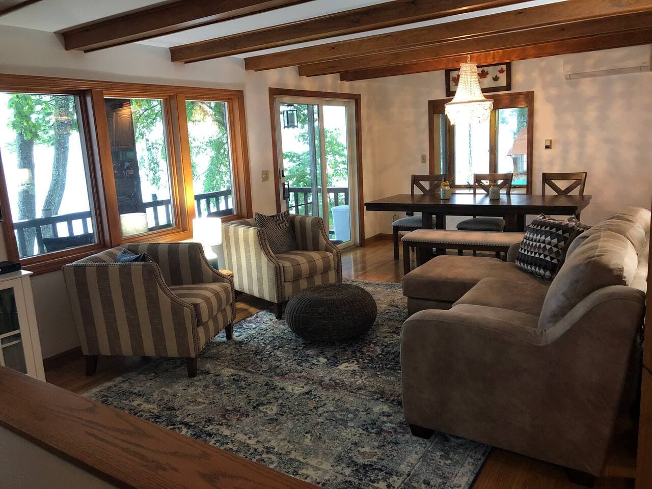 Living room in main house.  Adjacent porch looks directly over the lake.