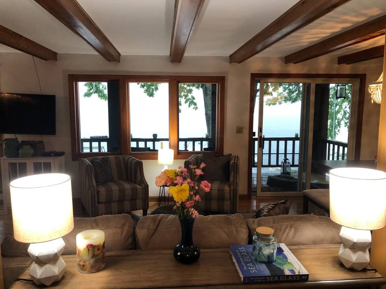 View from entrance way looking into living room and over the lake.