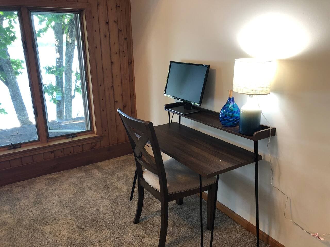 Small desk/office area in master bedroom with view of the lake.