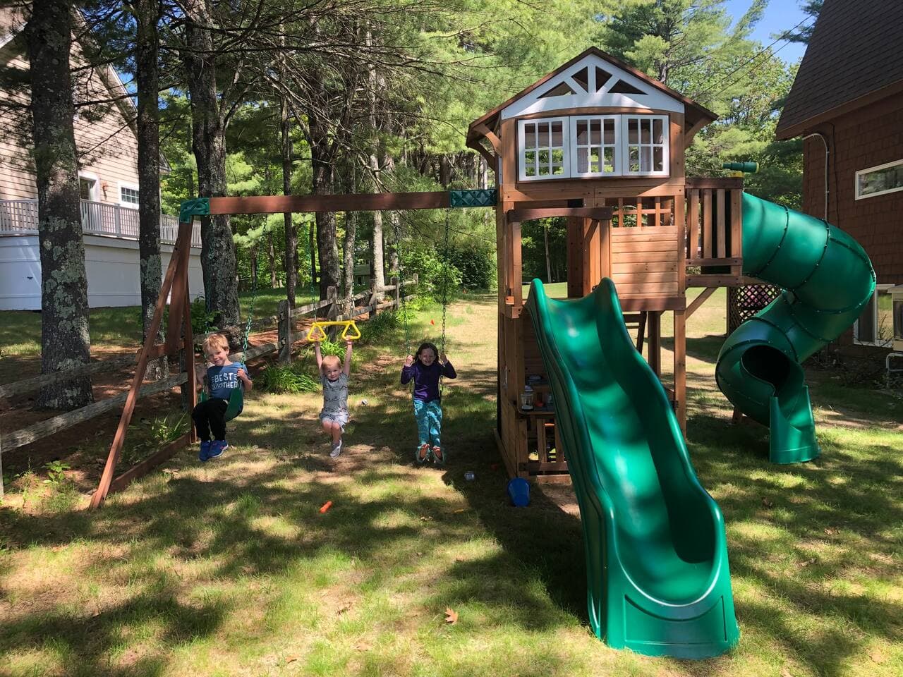 Children's play set next to house.