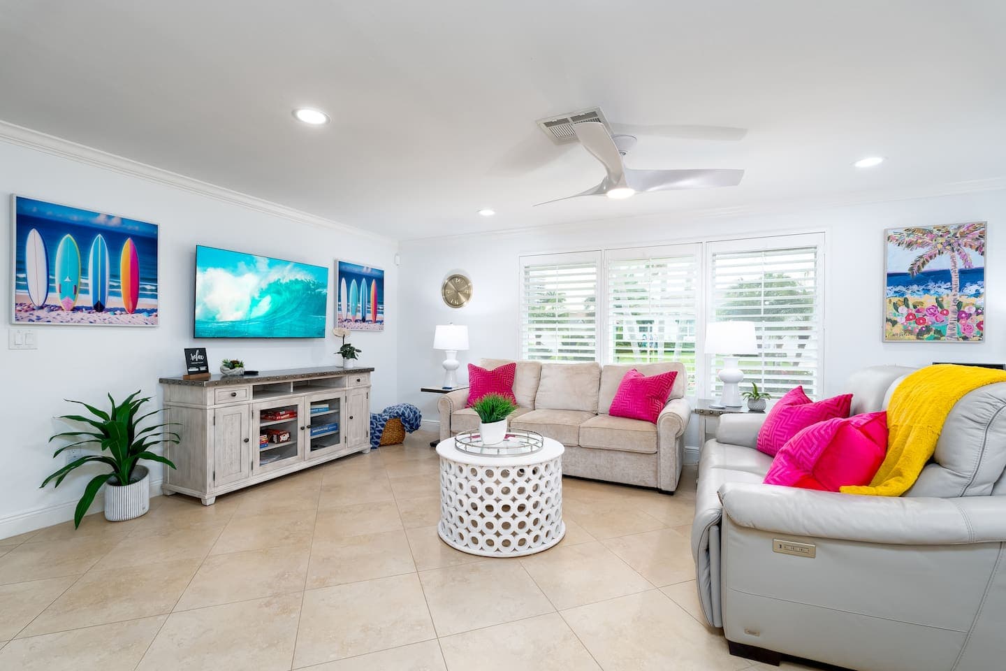 Comfortable living room with smart tv, sofa bed, and board games.