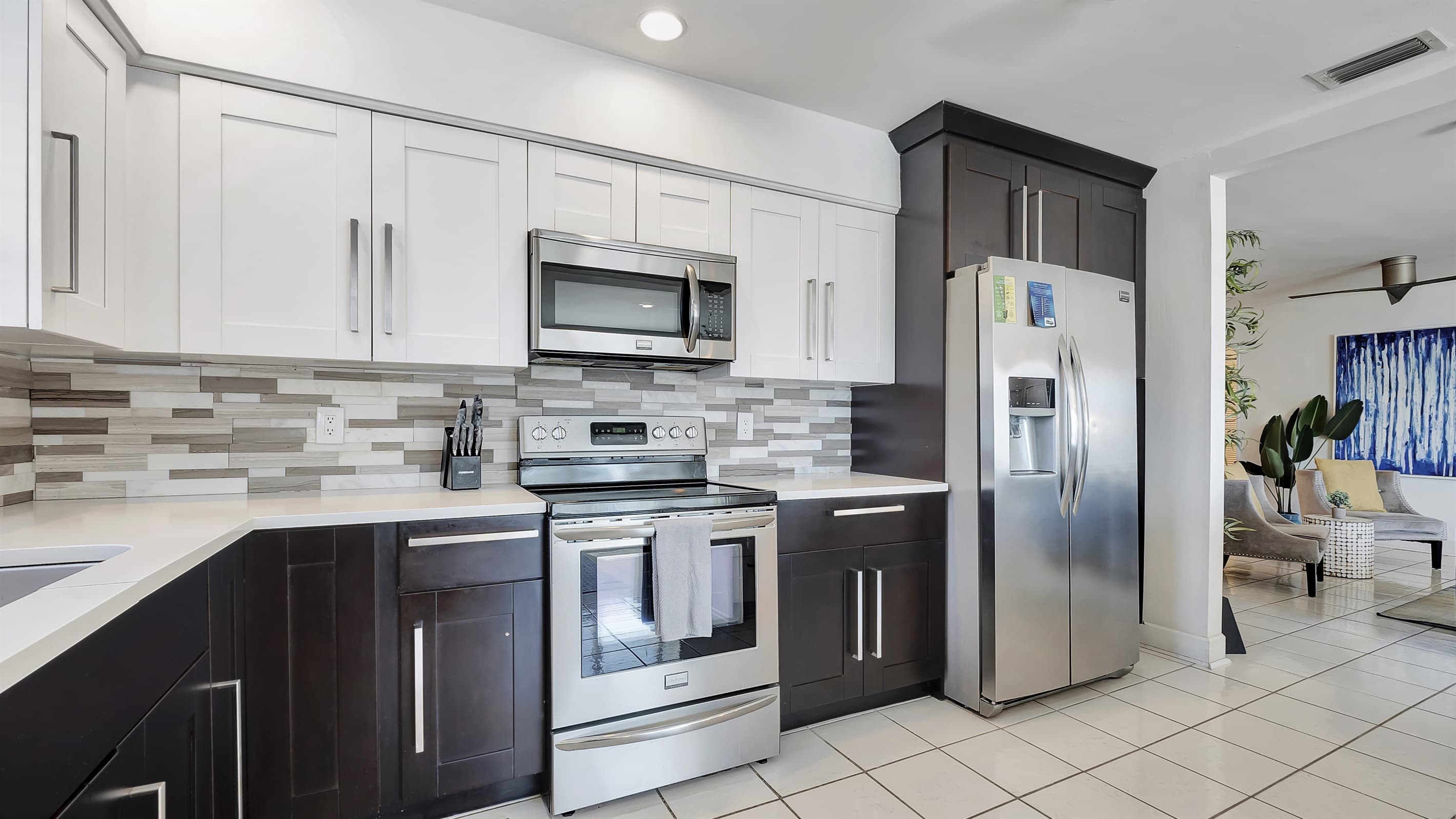 Monochrome, fully-equipped kitchen