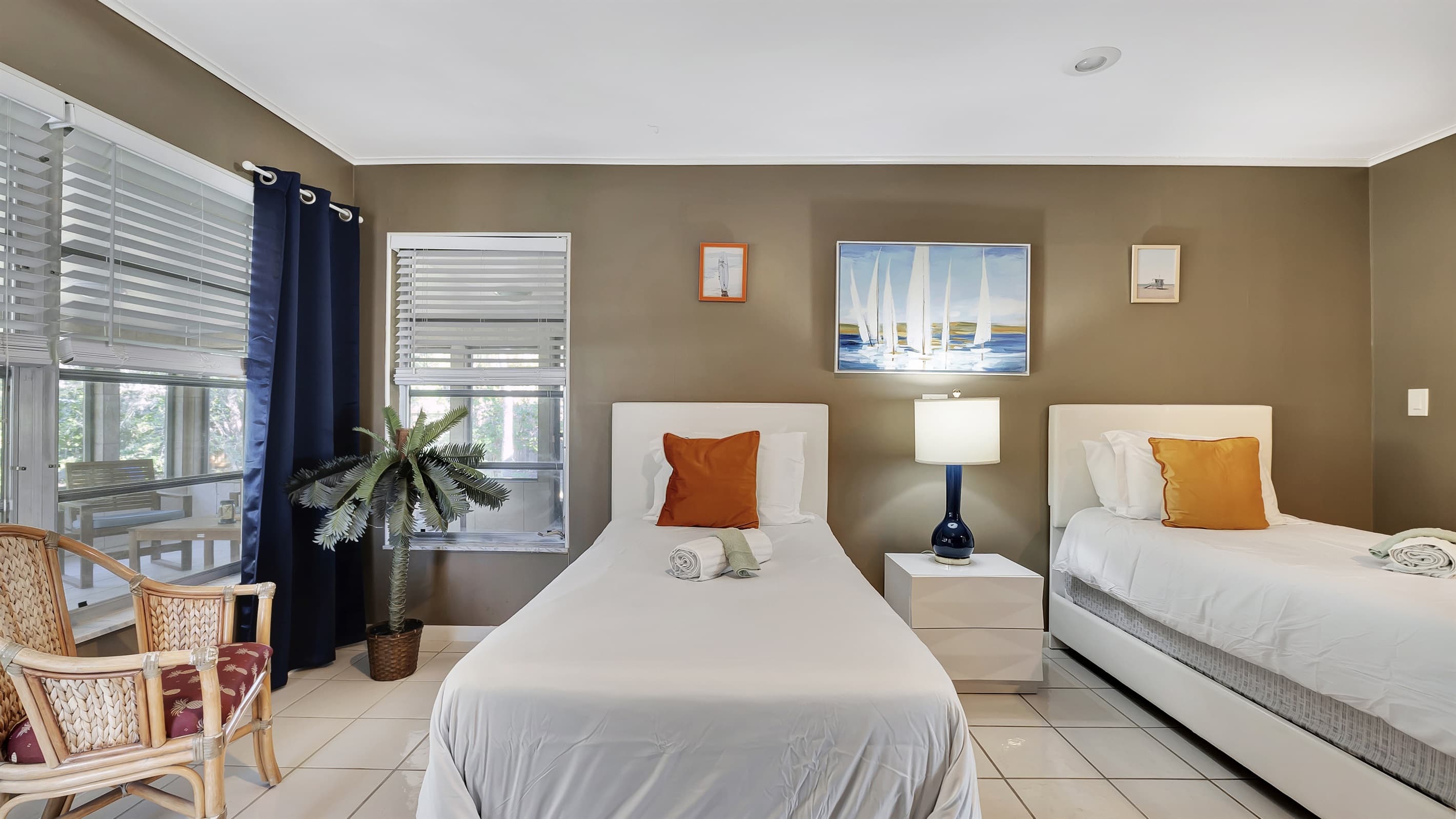 The twin room is adjacent to the covered porch area