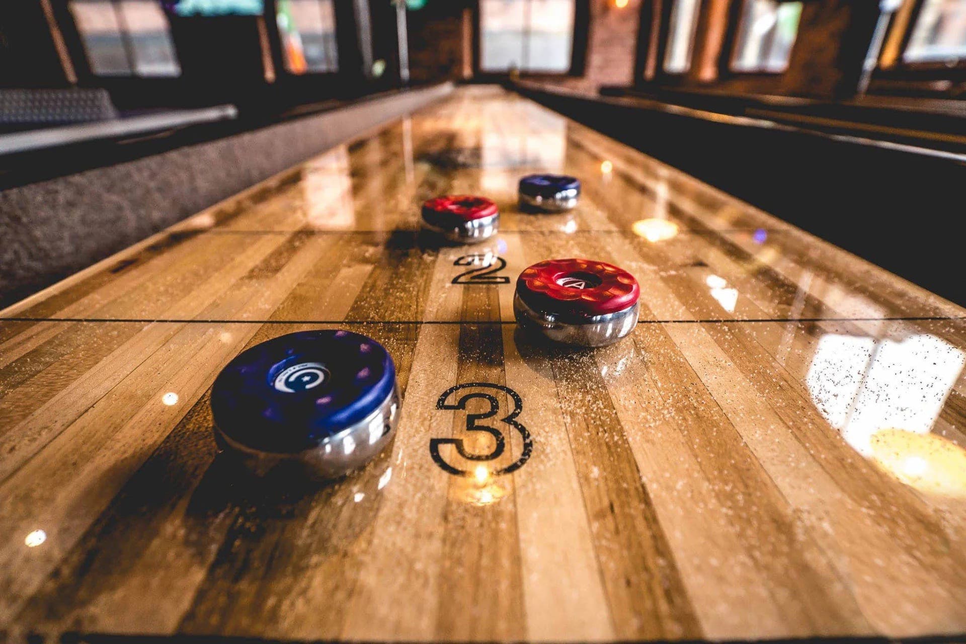 Shuffleboard and billiards are both available in the community game room.