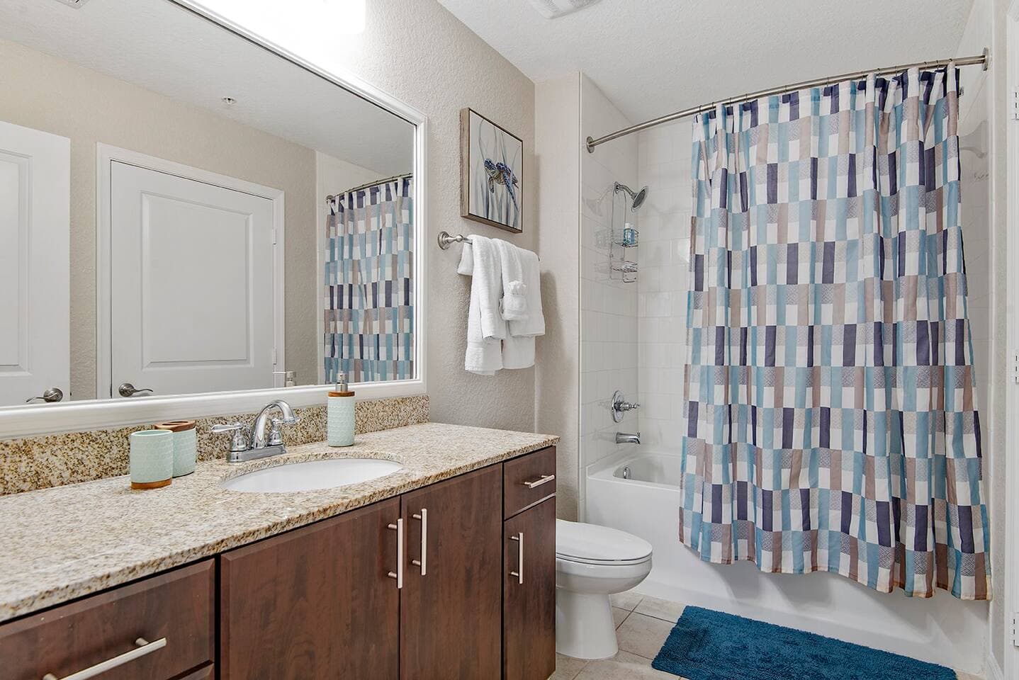 The large bathroom has granite countertops and complimentary toiletries. Shower/tub combination in the full bathroom.