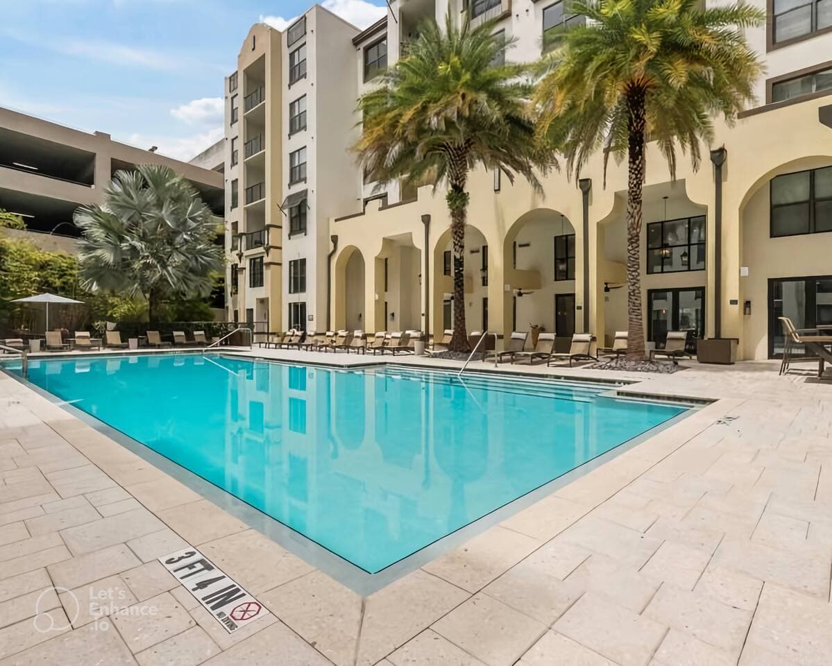 One of our favorite parts of the heated saltwater pool is the palm trees overhead! Shade or sun - you pick! The villa style pool is surrounded by other amenities, including gym, game room, grills, and outdoor kitchen.
