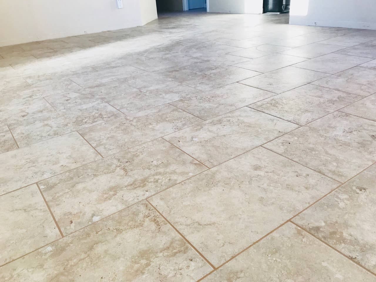 Travertine look porcelain tile floor in entire house