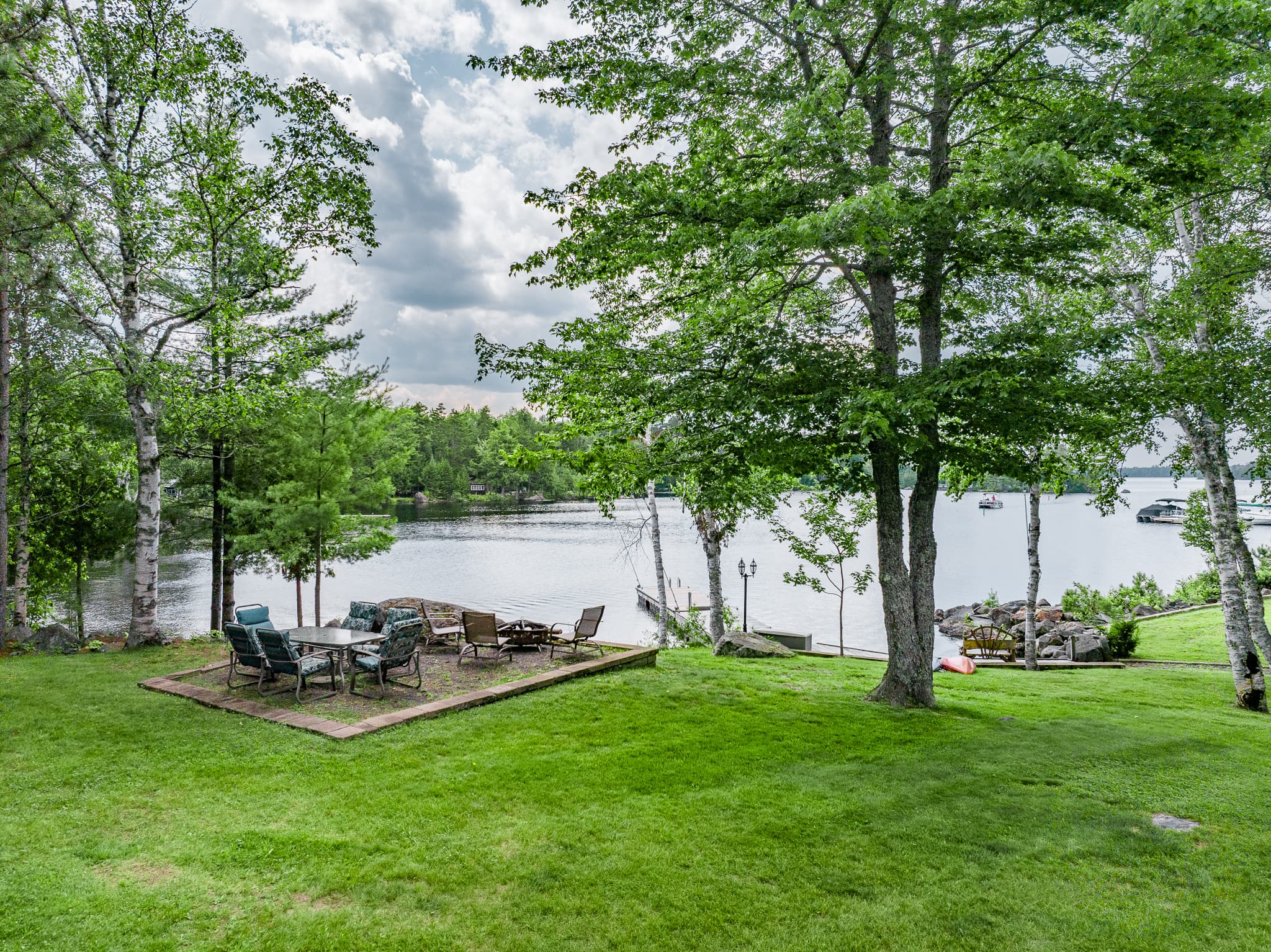 Seating area plus fire pit to enjoy a fire by the lake