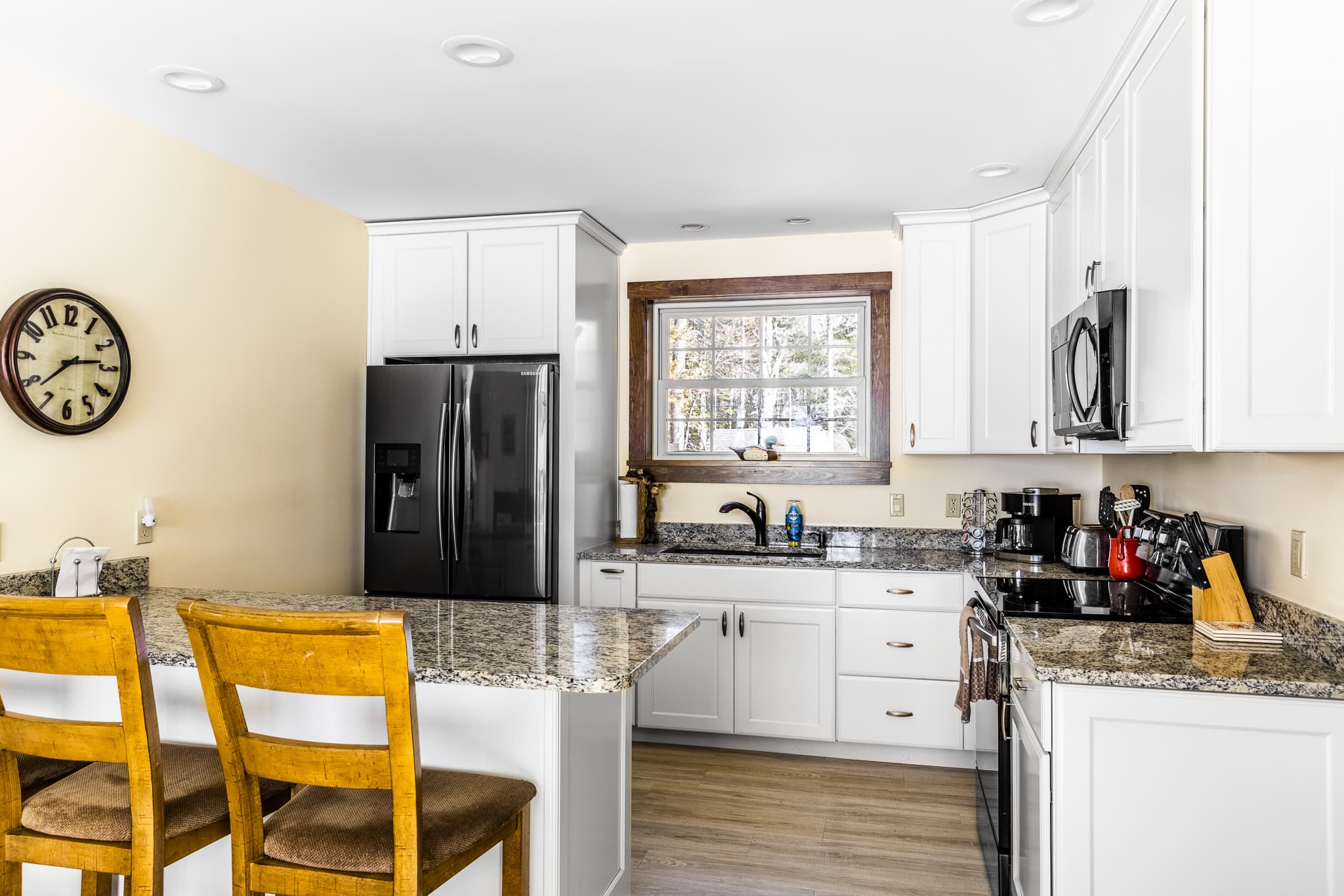 Full kitchen with seating.