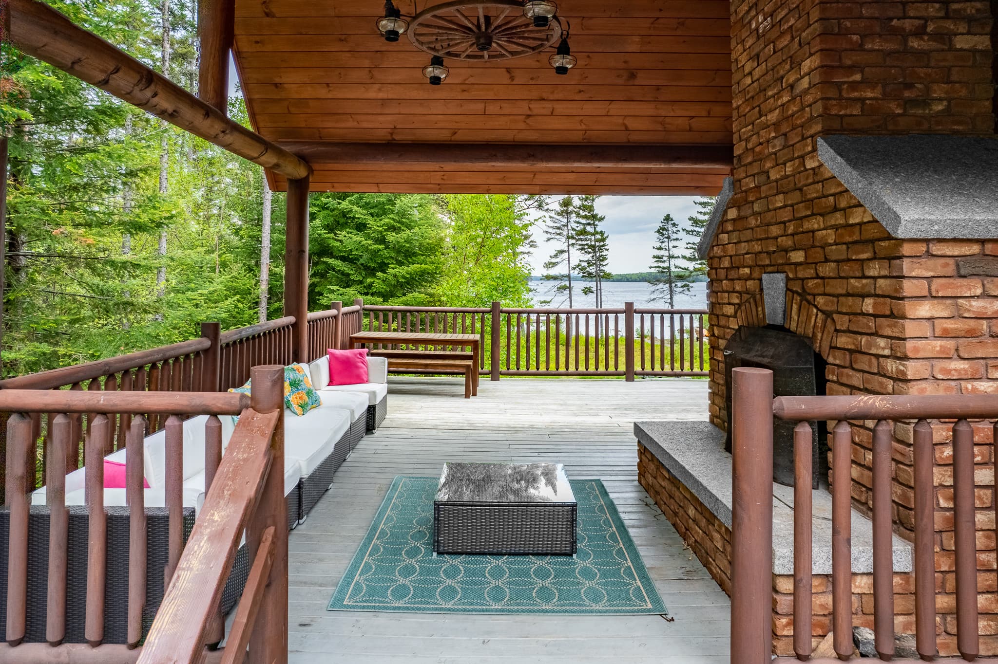 Large deck, both covered and uncovered. Enjoy the views, the outdoor fireplace, plus the grill with a seating area to enjoy a meal outside. One of the favorite spots to gather and relax by the fire.