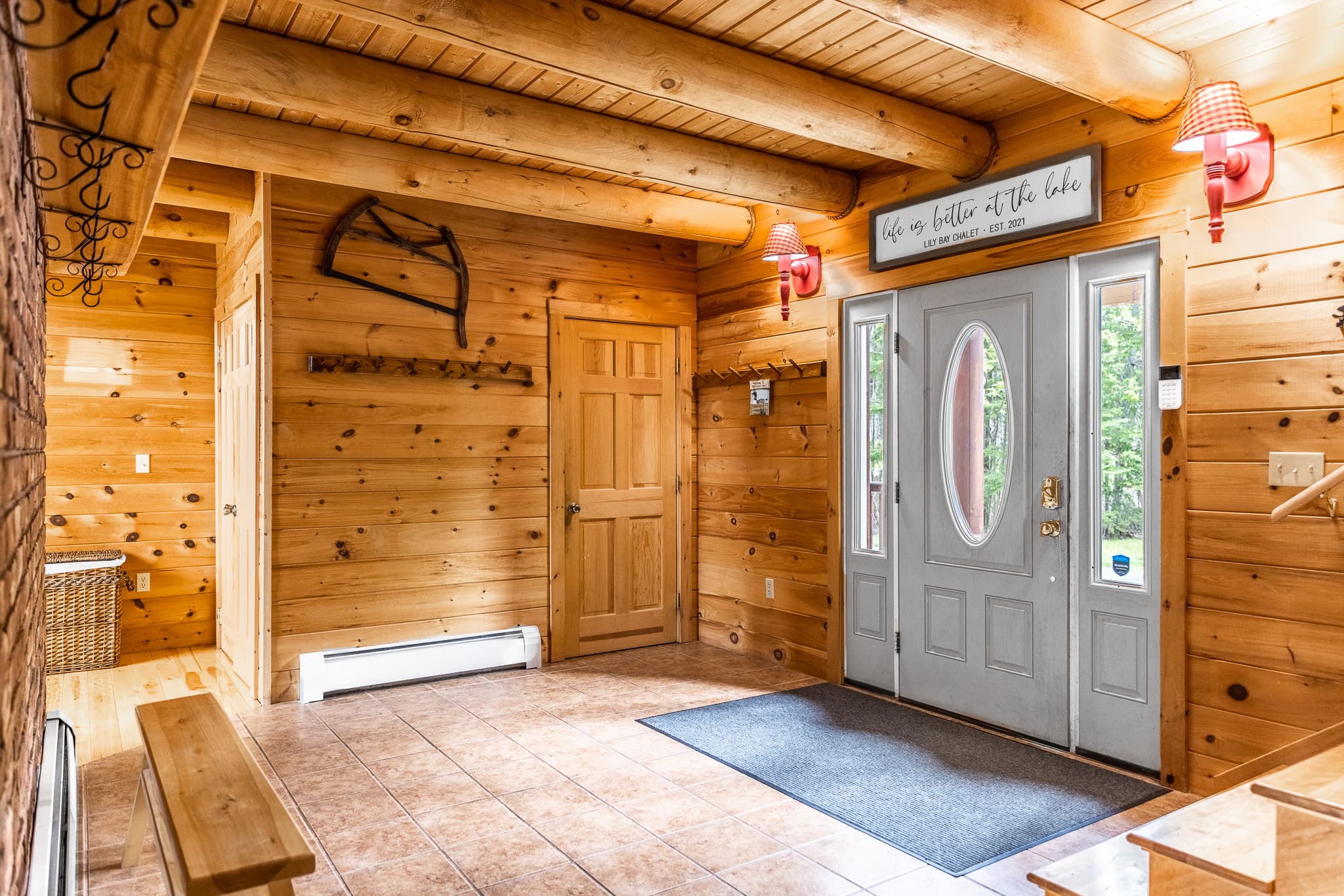 Chalet has huge logs and windows overlooking the lake giving it the true feel of lakefront retreat. 1/2 bath by main entrance in addition to 5 full bathrooms.