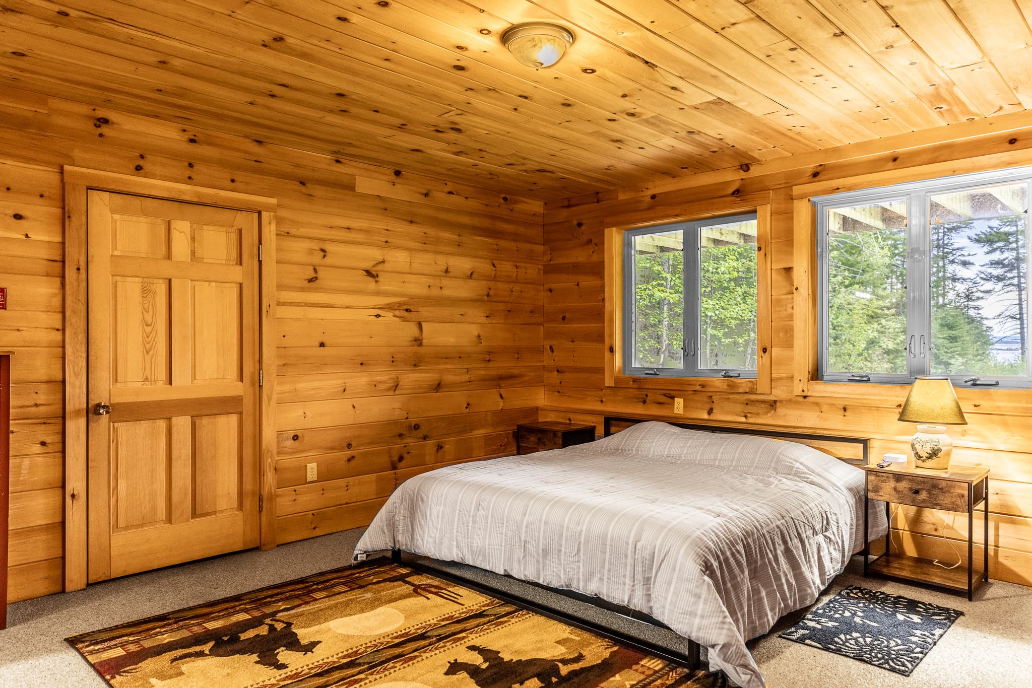 Enjoy the downstairs floor suite. Private and quiet, with views of the beautiful lake, a full attached bathroom, TV for streaming, clothing storage, and charger stations by your king bed.