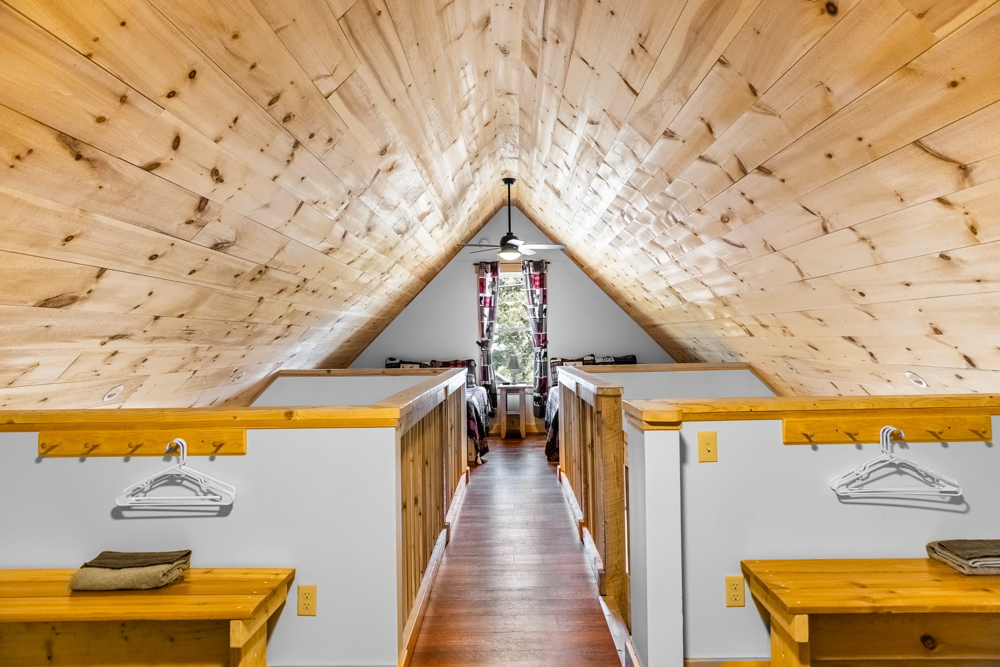 Cat walk connecting 2 sides of the loft, each side with 2 full beds.