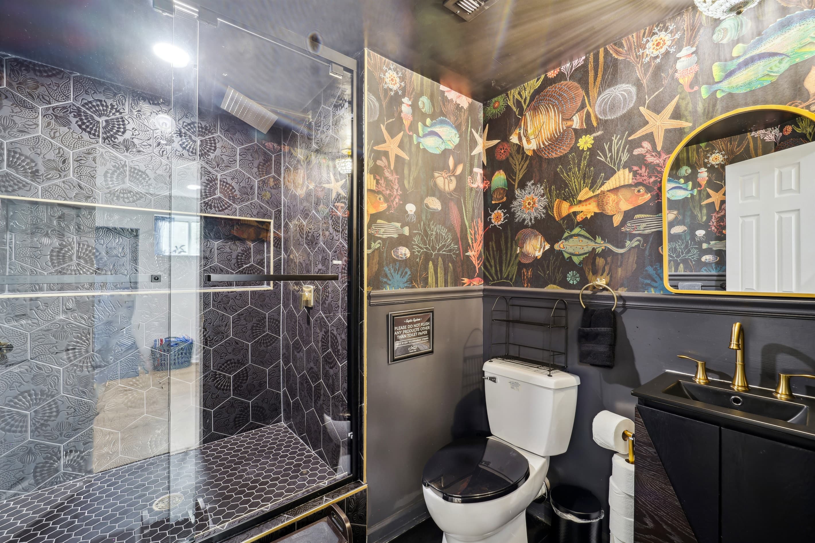 The walk-in shower in the basement bathroom is spacious and has a wonderful rainfall shower head.