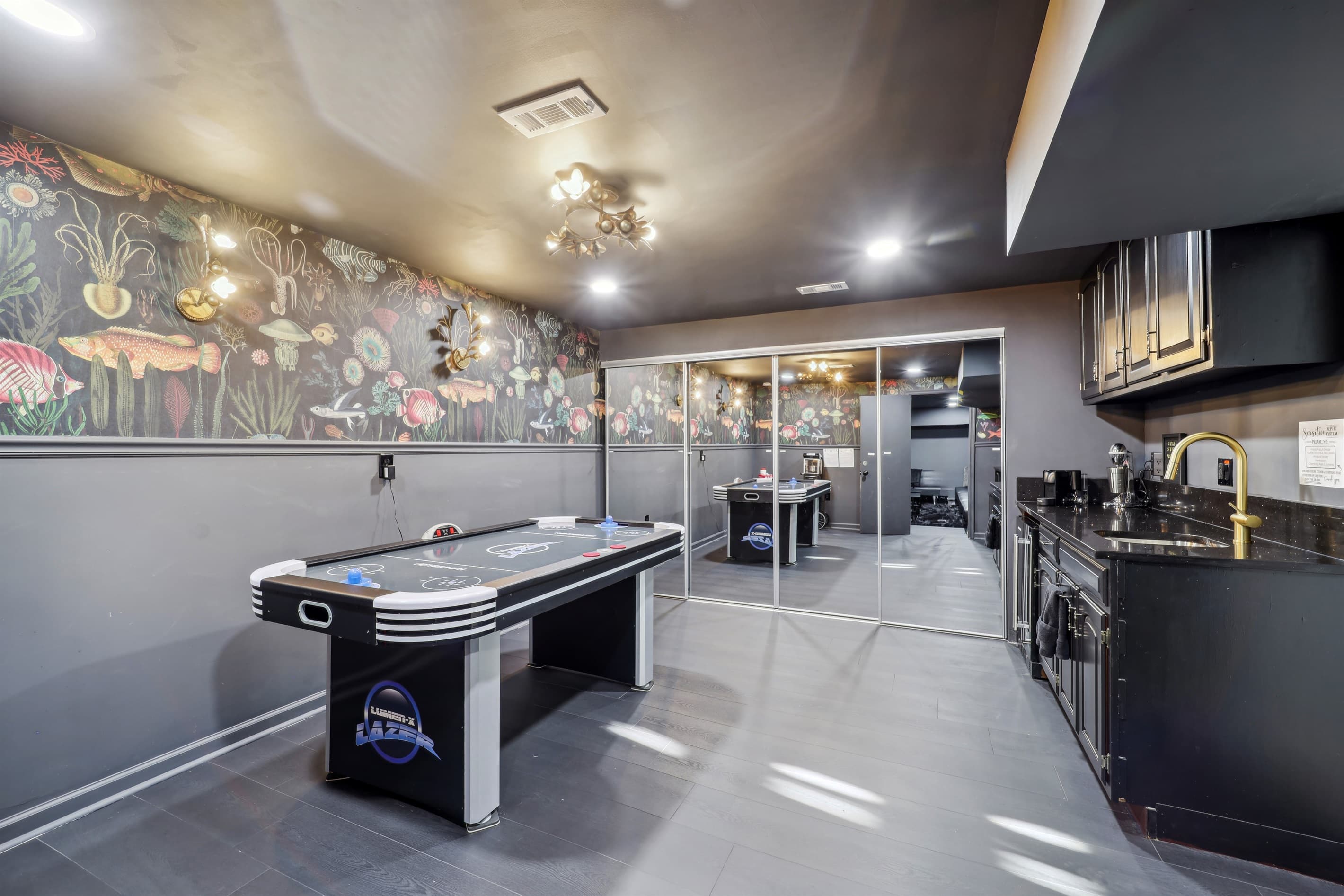 Live your best life in this bar and game room area in the basement