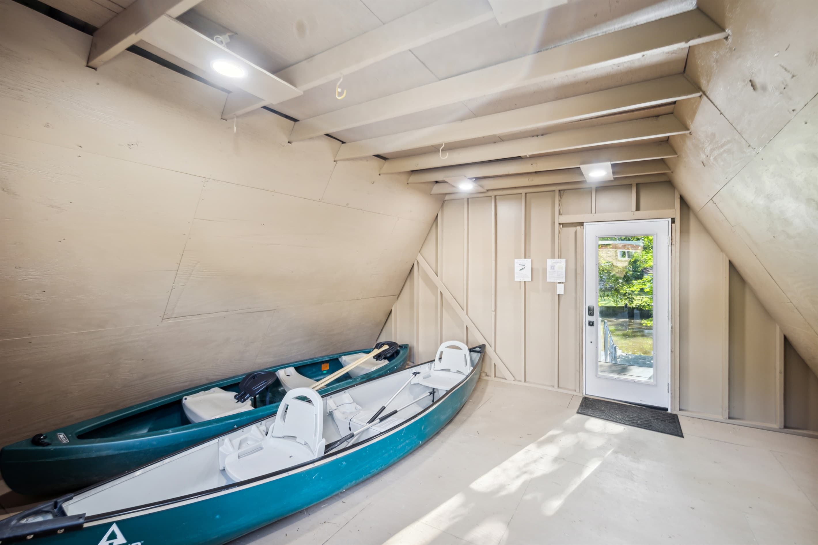 Two canoes are in the boathouse, each can carry up to 3 people. Life vests are also located in the boathouse.