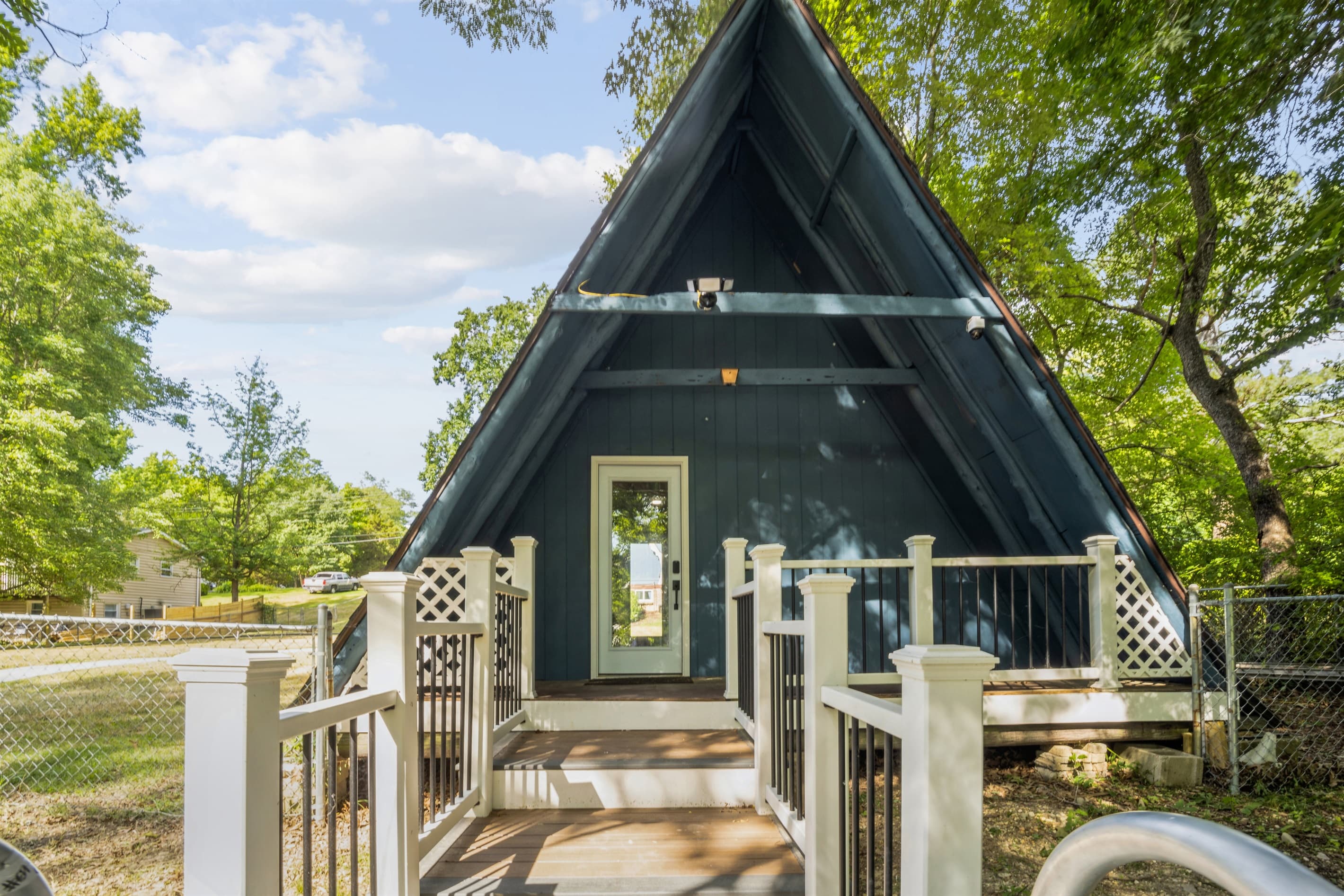 The floating dock is connected to the boathouse via a deck and gangway.