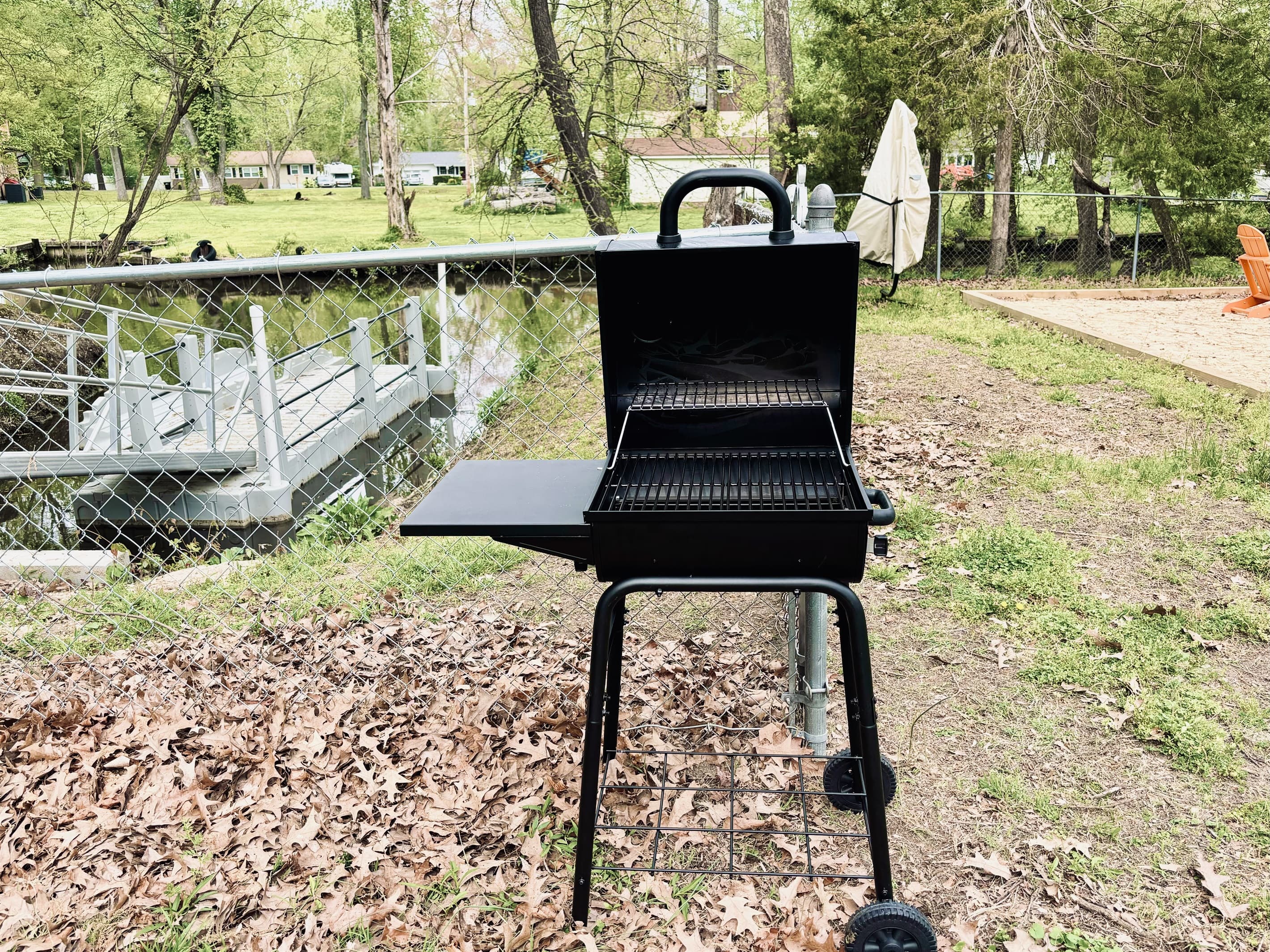 Grill up some meats on the charcoal grille  in the backyard