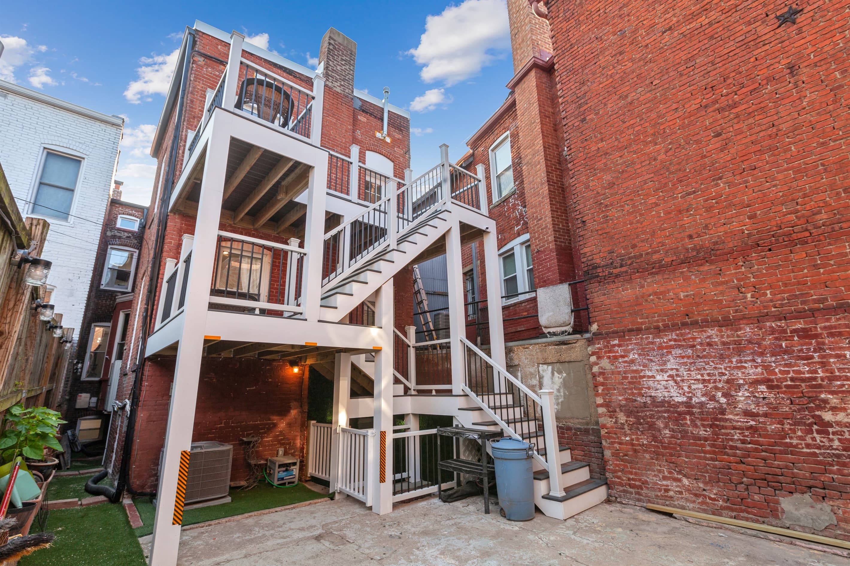 The backyard has a double-deck and is a shared space with the lower unit