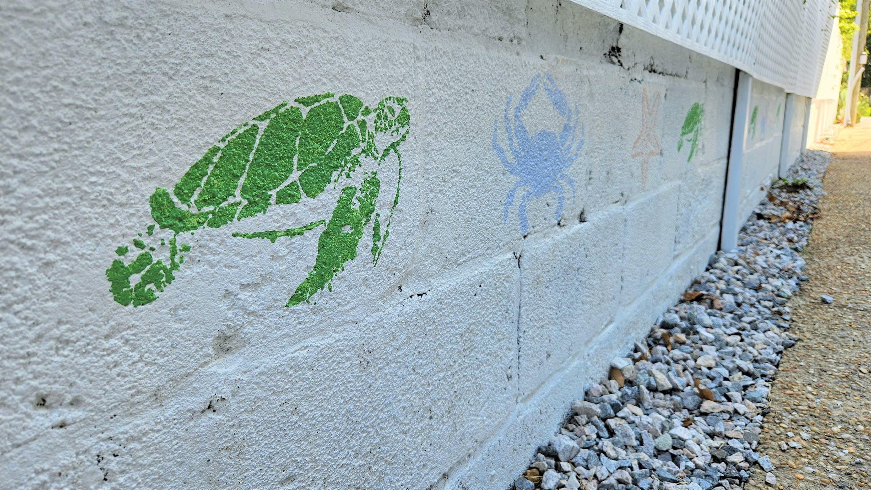 Wall murals decorate the exterior of the home