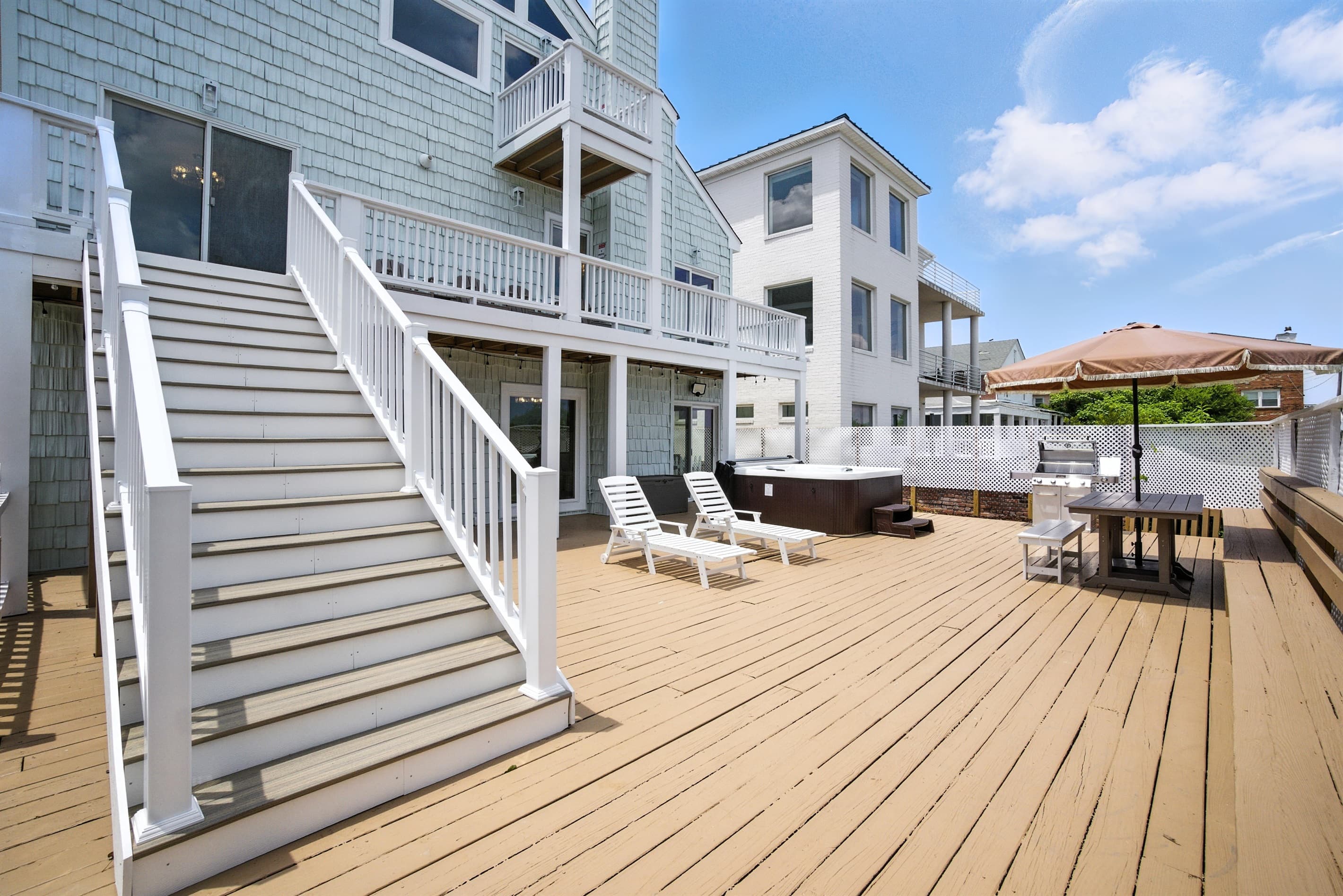 Backyard has stairs which provide an alternate way to get to the bedrooms on the second floor, for those who don't want to use the Spiral Stairs inside