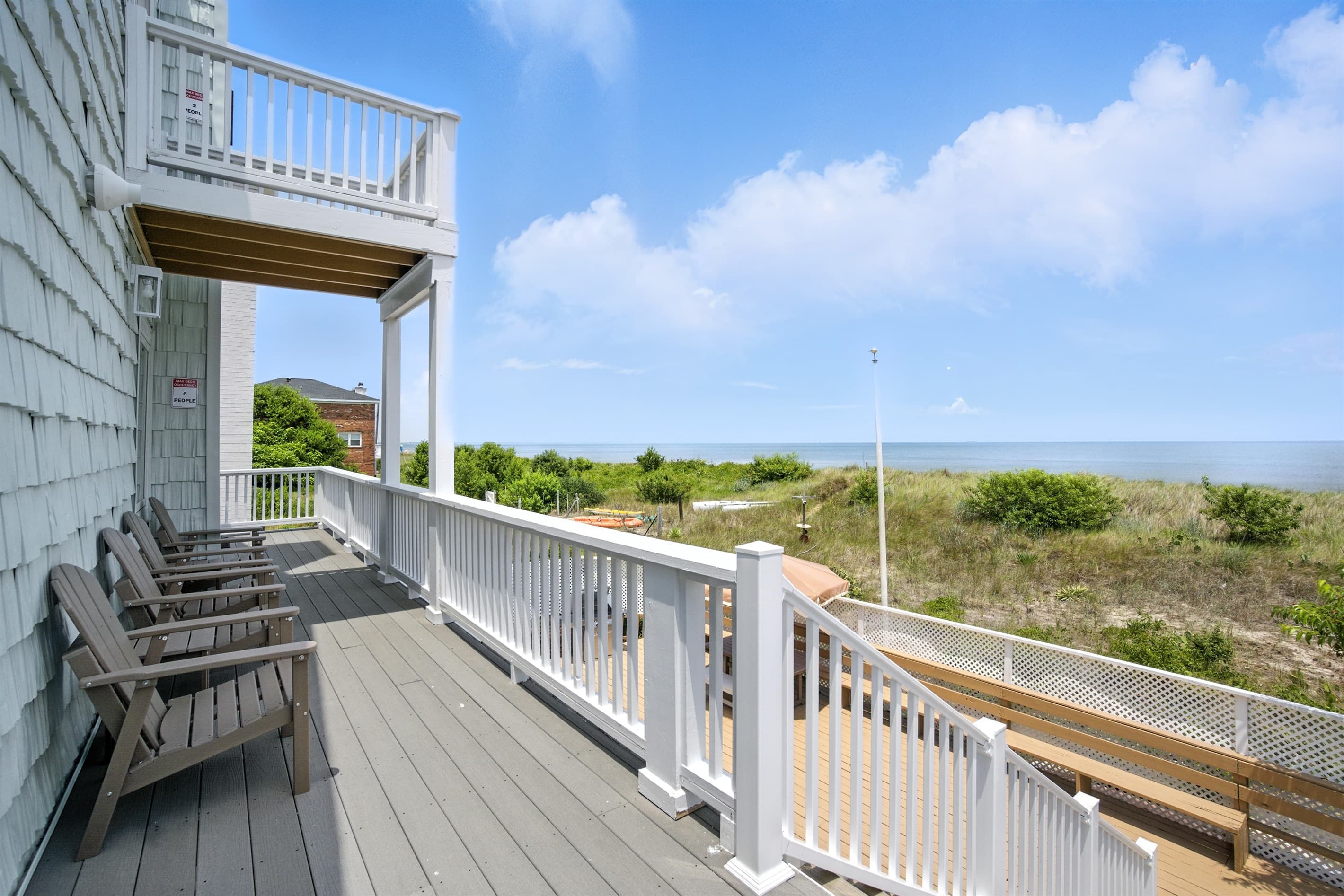 Second level deck has seating to enjoy watching sunrises and sunsets