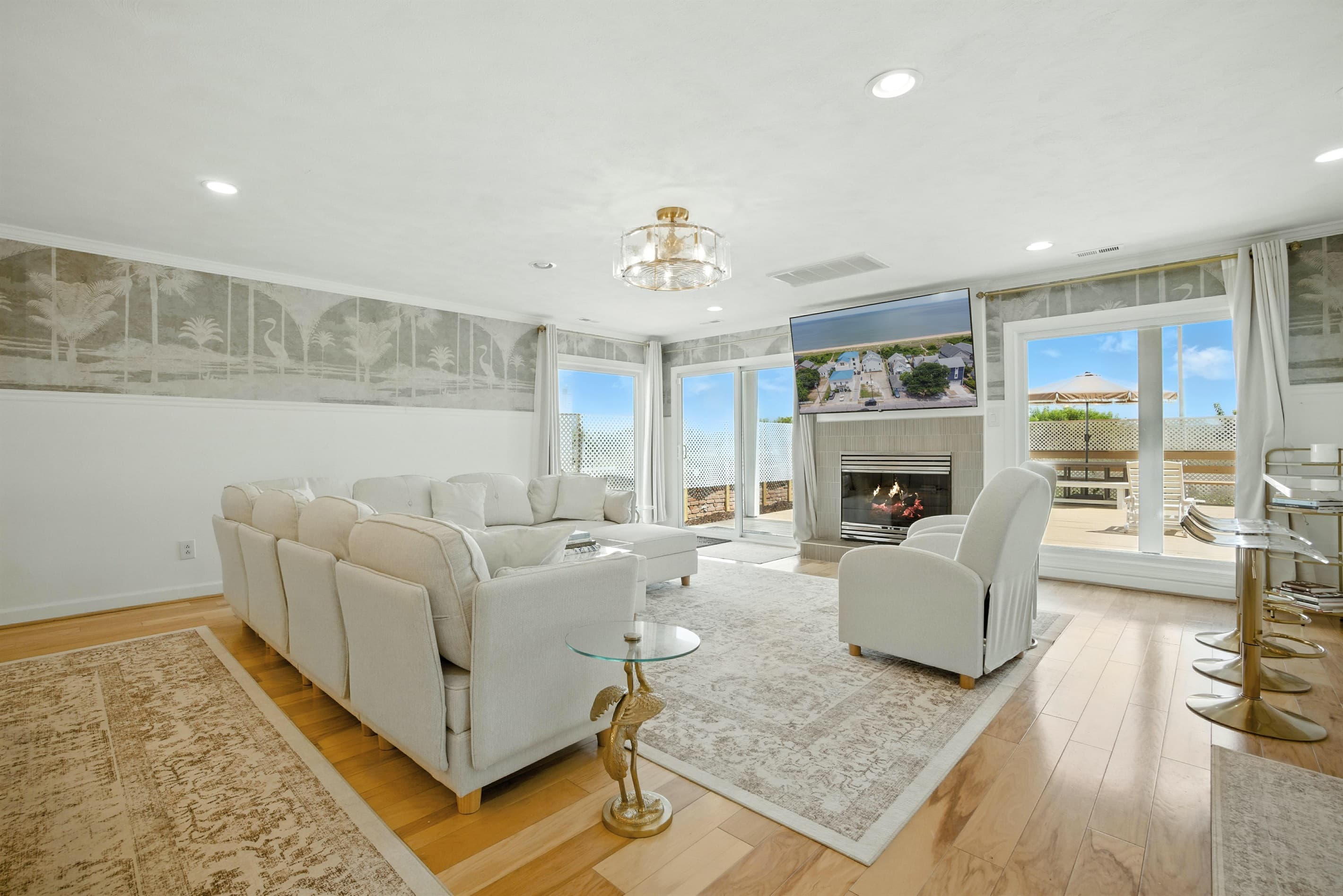 Living Room in Unit A has a gas fireplace and a sliding glass door with direct access to the rear deck