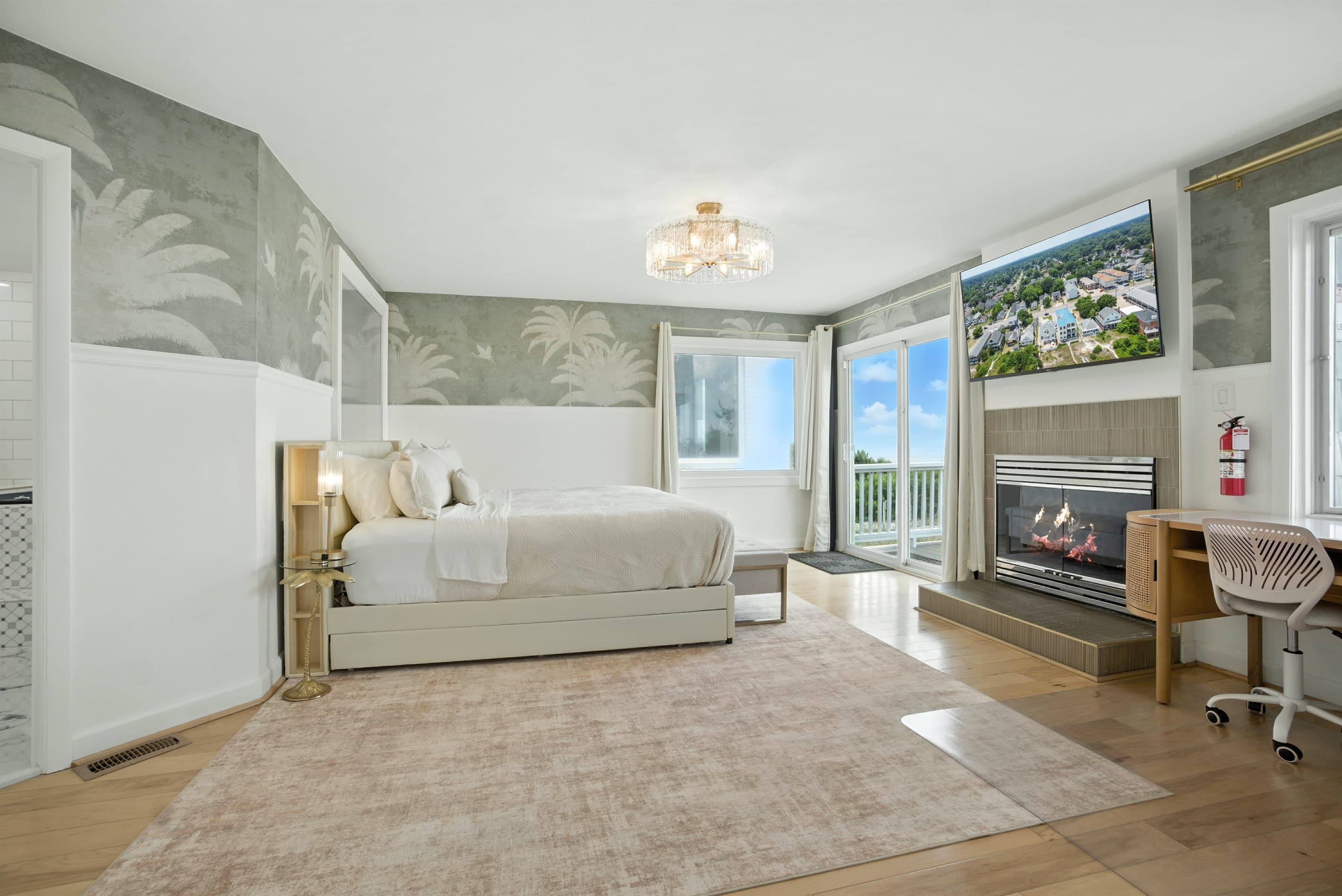 Primary Bedroom in Unit A is on the second floor, and is also accessible from the deck outside