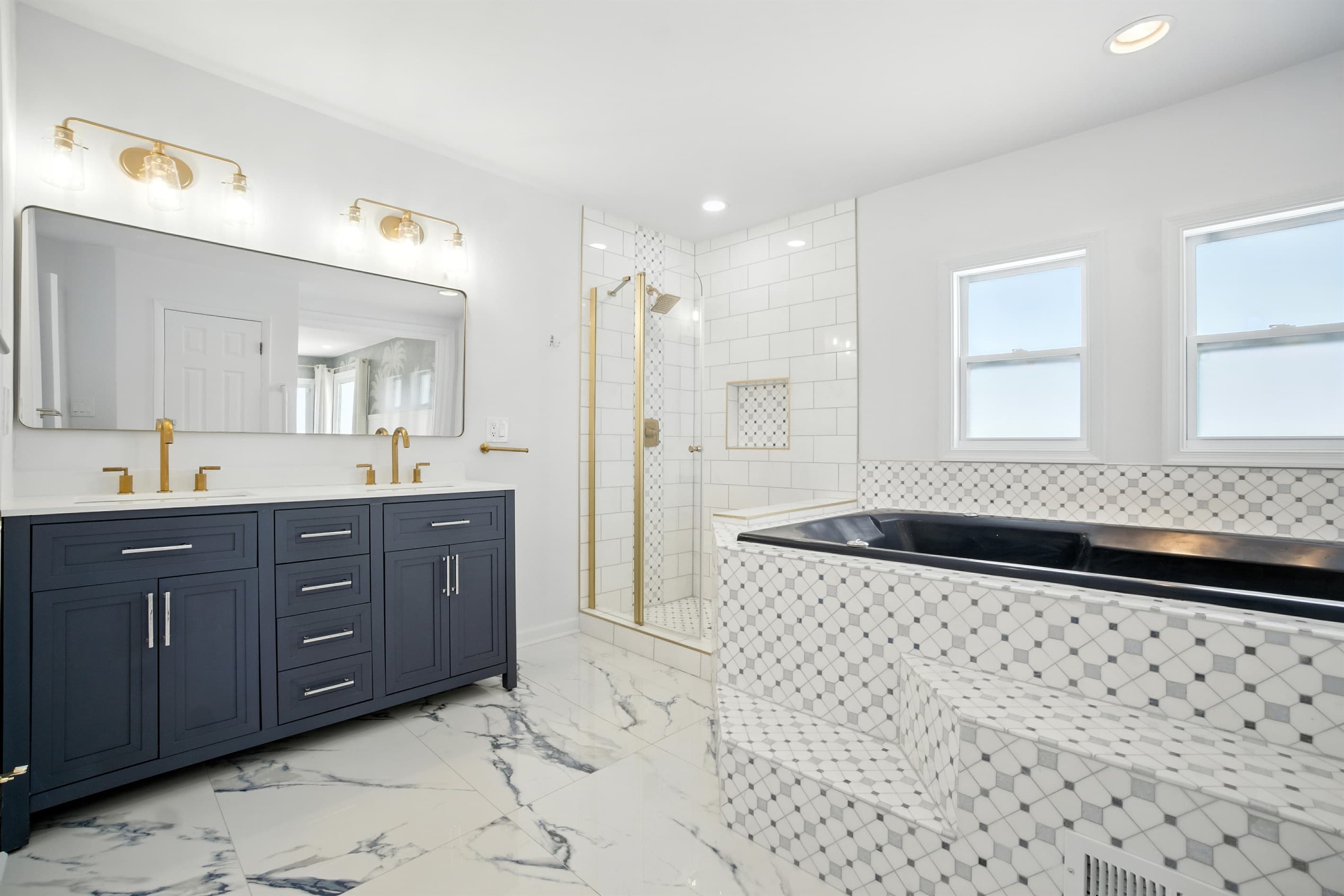 Primary Bedroom En-Suite Bath in Unit A has a Shower, Extra-Large Jetted Tub, Double-Vanity and Toilet Room