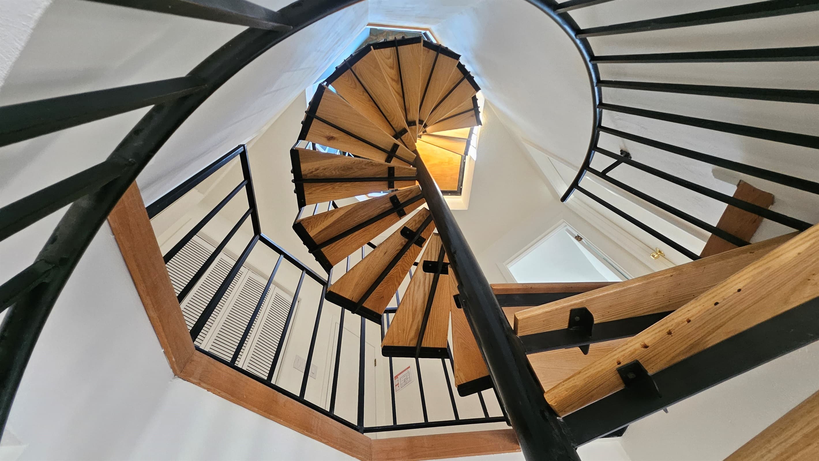 Spiral stairs connect the interior levels of the entire home